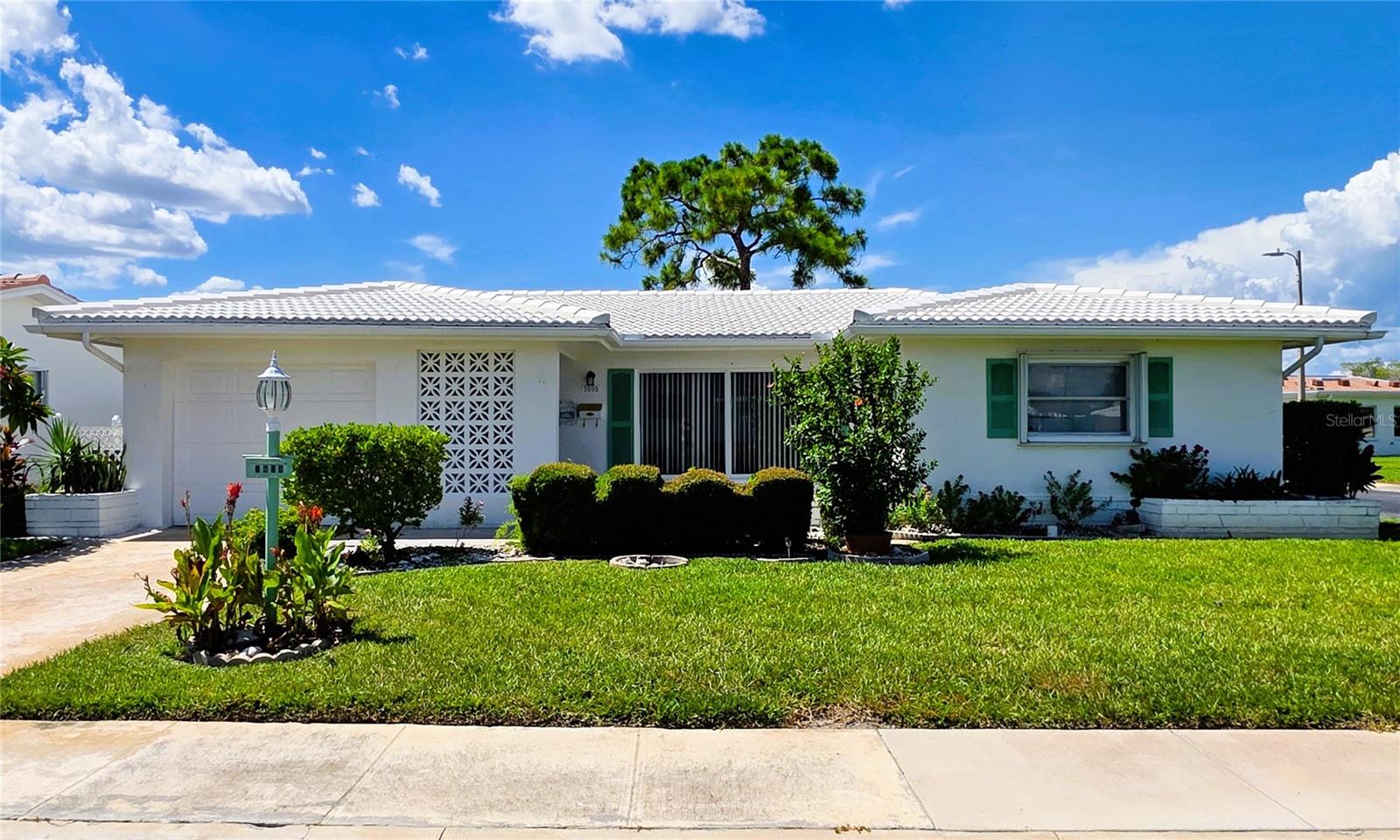 Welcome to this amazing 2-bedroom, 2-bath home, perfectly situated in the highly desirable 55+ community of Mainlands of Tamarac by the Gulf. Offering over 1,600 sq ft of living space on a corner lot, an oversized 1-car garage, this residence is ready for your personal touches to create your ideal sanctuary.
Enjoy spacious bedrooms with ample closet space, and peace of mind with a newer AC (2022), tile roof (2017), flat roof (2022) & hurricane shutters. Note this home did NOT FLOOD!
This isn't just a home; it's a lifestyle! Surrounded by a lush golf course, the community boasts 7 different clubhouses brimming with activities. Unit 4 clubhouse is just a short walk away, featuring a large heated pool and shuffleboard – perfect for leisurely days.
Experience true worry-free living with an HOA that covers roof replacement & repair, cable, internet, water, sewer, garbage, irrigation, lawn maintenance, and exterior paint.
Centrally located in beautiful Pinellas, you're just a short drive to both Tampa and St. Pete Airports, and a mere 10-12 miles from the stunning sandy beaches. Enjoy an abundance of nearby restaurants and shopping options.
Whether you're looking to retire in comfort or find your perfect second home, this property is a must-see.
Book your private tour today and start living the Florida dream!