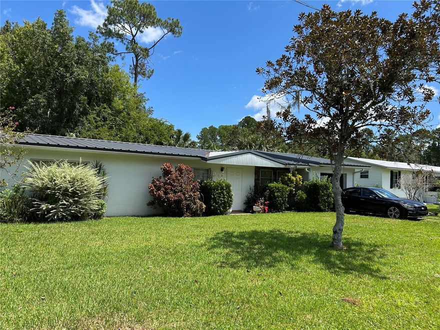 This comfortable, well maintained, 2 bedroom, 1 1/2 bath, concrete block home has two large outbuildings, for all your workshop and storage needs. Sturdy home with newer metal roof installed in 2021, new A/C and heat pump installed in 2020, new breaker box installed in2022 and new conduit and wire to the large garage installed in 2023. Located on two lots gives you plenty of room between you and your neighbors. The town of Astor has that small town feel with multiple restaurants, grocery store, and fresh seafood shop. With the St. Johns River Running Thru it, fishing is a main attraction as well as the springs located just a short boat ride away. Just relaxing, cruising down the river can be a wonderful time. Astor is surrounded by the Ocala National Forest with an abundance of wildlife, hunting and side by side riding are a great hobby here. As well as being centrally located, Ormond Beach is 40 minutes away, Orlando 1 hour, Ocala 40 minutes and the great little town of Deland is 30 minutes away. Put this one on your list to see, make a showing appointment today!