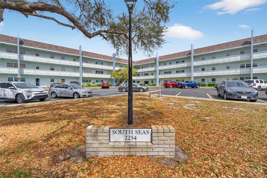 Discover an exceptional opportunity to embrace a lifestyle defined by comfort, convenience, and vibrant community living in this beautifully updated Ground Floor End Unit 1 Block from Harbor Lake. This home invites you to enjoy every moment without the hassle of upkeep.
This Emerald model is boasting 1,400 square feet of elegantly arranged space; the residence welcomes you each morning with abundant natural light streaming through updated windows. The open-concept kitchen is a culinary haven, featuring exquisite cabinetry, gleaming granite countertops, a striking tile backsplash, generous storage—including an oversized pantry—and modern stainless-steel appliances. For added ease, the washer and dryer are discreetly placed in their own closet. The updated plank flooring throughout the unit not only enhances visual appeal but also offers durability and seamless continuity.

Both spacious bedrooms and two bathrooms have been thoughtfully renovated with fresh tile, contemporary vanities, and chic modern finishes. Ceiling fans foster a tranquil environment, while a new A/C and water heater (installed in 2022) promise comfort in every season. For individuals considering a snowbird residence, the option to negotiate furniture provides added flexibility and convenience, allowing them to tailor the living space to their specific preferences and needs.

Beyond your doorstep, the West Activity Center beckons with dynamic social events, and the nearby dog park welcomes pet owners to connect and unwind. Assigned parking ensures convenience, and you’re just a block away from the serene vistas of Harbor Lake.

This residence is thoughtfully designed for individuals who appreciate the perfect blend of refined style, low-maintenance living, and a vibrant, welcoming community. Step inside to discover an environment where every element has been intentionally curated to foster comfort, relaxation, and active engagement. Ideally positioned on the highly desirable west side of On Top of the World Clearwater’s renowned 55+ golf community, this home offers a truly maintenance-free lifestyle. Seize the opportunity to make this remarkable property your own and elevate your daily living to new heights.