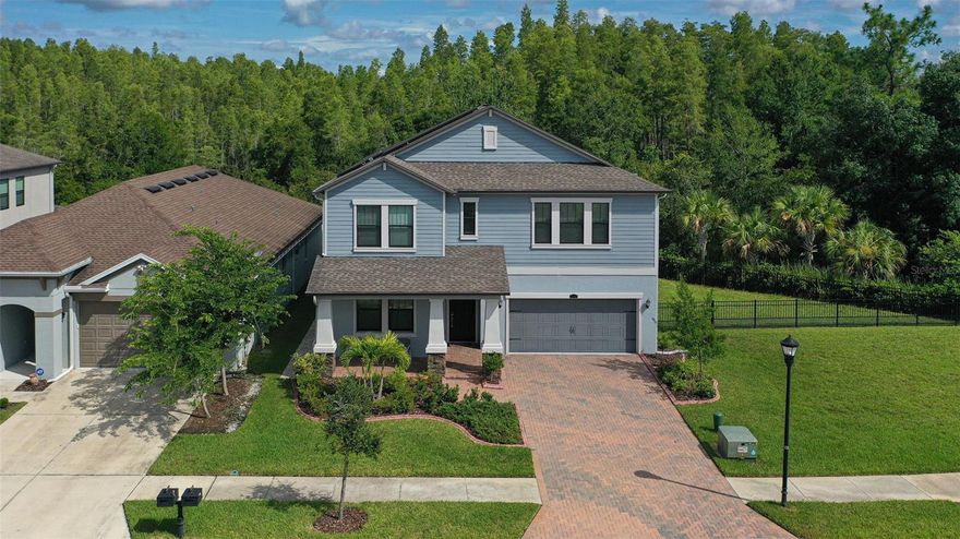 MOVE IN READY RENTAL DREAM HOME!!! TESLA WHOLE-HOUSE SOLAR SYSTEM SAVE BIG ($$$THOUSANDS A YEAR$$$) ON YOUR ELECTRIC BILL (AVG MONTHLY BILL IS $25 WHICH WILL SAVE YOU AT LEAST APX $300 A MONTH!) & SAVE CHARGING YOUR EV VEHICLE. LAWN CARE INCLUDED!! VERY POPULAR FLOOR PLAN! This beautifully maintained home features massive 3,834 sq ft of luxurious living space with a fantastic open floor plan, high ceilings, 5 Bedroom/3.5 bath/3-car tandem garage with no backyard or side neighbors which is located in the highly sought after are of TAMPA PALMS community of STAFFORD PLACE. HUGE LOT WITH ALMOST 1/4 ACRE! This extremely versatile floor plan offers a downstairs master bedroom, flex room which can serve as a formal dining room, den or office and laundry room on both floors! Gorgeous Spacious open kitchen with extended 42" stacked cabinets/crown molding, stainless steel appliances, microwave, Island, granite countertops, beautiful glass tile back-splash, breakfast bar, includes a butler's pantry, huge walk-in pantry, plenty of recessed lighting and a computer area. Spacious living room perfect for entertaining that opens outside to a huge private extended covered screened lanai with a full outdoor kitchen & pavers that invites you to sit & enjoy day & evenings sun sets that looks out onto beautiful landscaping & conservation area. Plenty of yard space to enjoy BBQ’s with family & friends. Just off the living room is the downstairs owner's suite which features tray ceiling with crown molding, Stunning Master bath features granite double sinks with vanity area, garden tub, large walk-in shower with upgraded beautiful tile, walk-in closet with built-ins. Upstairs features 4 large bedrooms each with a spacious walk-in closet, two full baths w/dual sinks, a massive 21x26 bonus room, theater room, play room, man cave or to use the room to create your own multi-purpose space. A full laundry room with washer/dryer is conveniently located upstairs while there is also a downstairs laundry closet with washer/dryer hook up (which could be used for additional storage or a wine cellar). HOME ALSO FEATURES: TESLA 11.56 KW Whole-house SOLAR SYSTEM WITH EV HOOK UP, WATER SOFTENER & PURIFIER, EPOXY FLOORING IN THE GARAGE & MUCH MUCH MORE! Stafford Place at Tampa Palms is the perfect retreat tucked away in the heart of New Tampa area. This home is a must see! Close to all, great shopping & dining, restaurants, minutes from I-75/275. USF, Moffit, Flatwoods preserve, hospitals, shopping malls, golf, excellent rated schools.