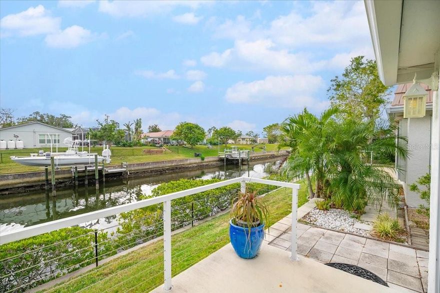 Up on the bluff, HIGH AND DRY! Welcome home to this HIGHLY coveted WATERFRONT GEM located in picturesque 55+ community of Strathmore Riverside Villas..10 mins from World Famous Siesta Key! Desirable North South exposure allows for fantastic sunrises and sunsets from your back patio on the canal! Inside you will find a TOTALLY REMODELED villa with UPGRADES GALORE! This home features a chef's kitchen including high end quartzite countertops, floor to ceiling upgraded shaker cabinets, extended cabinets/countertops into dining room for hosting, tiered designer island, and raised ceiling height throughout the home for a welcoming feel! Another upgrade includes kitchen venting to exterior! Open concept living area with TONS of natural light and views of the waterway. Raised sunroom floor so all floors are level throughout the home! High end luxury vinyl plank NuCore flooring throughout, waterproof and upgraded soft feel! Designer remodeled bathrooms with high end materials, easy step in showers, sunlamps, AND exterior venting! Many sliding pocket doors throughout for space savings and upgrade design. Additional major system upgrades include double pane hurricane windows AND all window casings replaced, all new PEX plumbing throughout, all underbuilding sewer/drain lines replaced, upgraded electrical panel, ALL NEW HVAC ductwork throughout, and added rain gutters! Back patio recently repoured with upgraded cable railings and repoured extended header. Community highlights include a private marina, clubhouse which hosts many social events, library, dance floor, dining tables, kitchen, billiards, shuffleboard courts, outdoor heated pool, BBQ area,…there are always fun activities happening here! In addition to HOA maintaining landscaping, they also maintain sprinkler system! Deeded for 2 included parking spaces + PLENTY of guest parking. Close to shopping, restaurants and world class beaches! Call to schedule your private tour today!