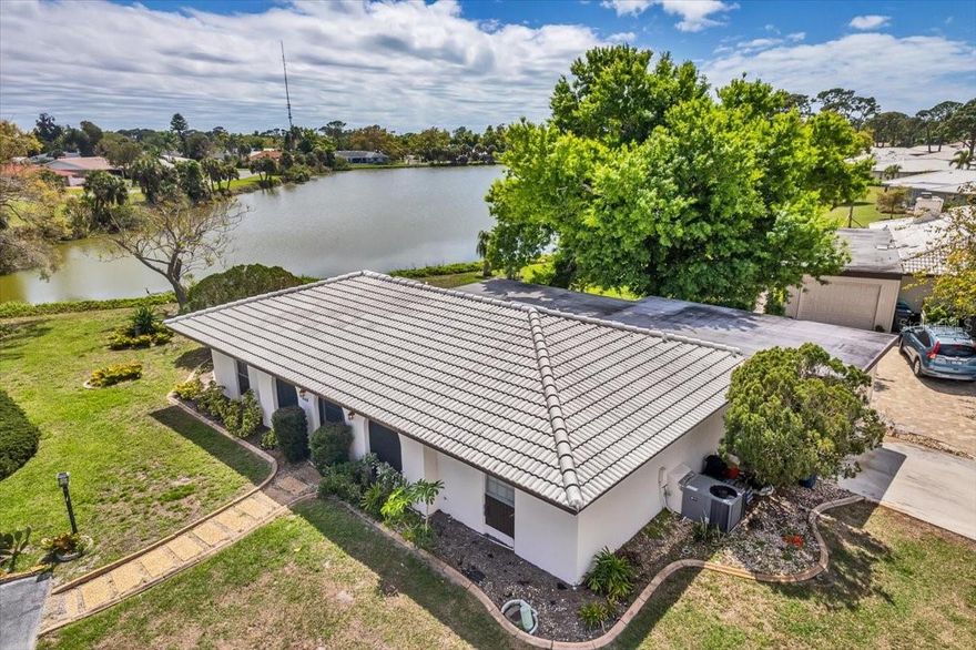 Long Lake view, from this free standing Villa. 2 bedrooms, 2 baths, 1 car garage, plus extra parking place by front door.  HOA is $ 535  month BUT it does included the Roof, Lawn care, outside maintenance, and outside painting. Making it a maintenance free condo without neighbors above, below, or around you . Whole house reverse osmosis system. County water and sewer. Block construction. Not a 55 community, X Flood zone means no flood insurance.  4 miles to Nokomis beach. 5 miles to downtown Venice, 13 miles to Sarasota.
Buy today, rent tomorrow