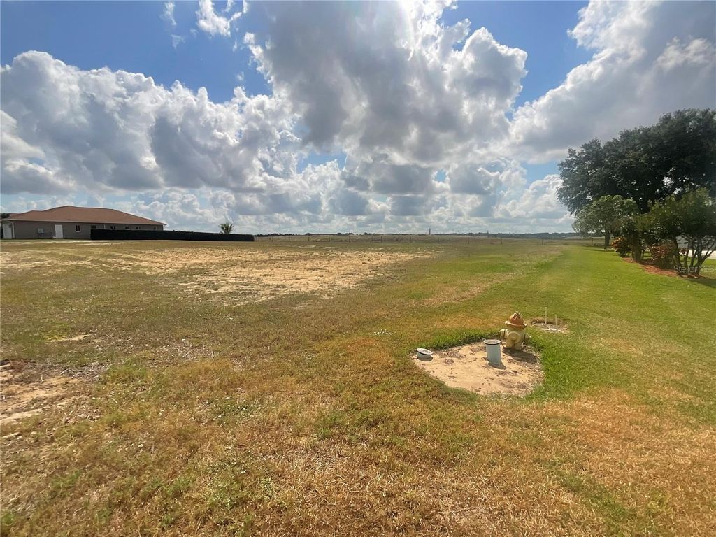 Photo of 547 Sunset Pointe Drive, Lake Placid, FL 33852 (MLS # C7510459)