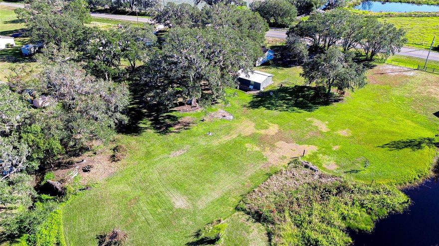 Discover the timeless charm of this 1.75-acre lot in the heart of Plant City, a rare find brimming with character and potential. Conveniently located near I-4, this centrally positioned property makes travel a breeze while maintaining the tranquility of rural living. The land is flat and beautifully adorned with stately oak trees that provide the perfect balance of shade and open space, creating an idyllic setting. With three access points, this property offers exceptional versatility. A serene pond on the neighboring lot adds to the picturesque landscape, while strawberry fields across the street lend a touch of Plant City’s iconic beauty. This property has been cherished by the same family for generations, holding countless memories of a life well-lived. Whether you envision building your dream home or simply embracing the peace of this unique retreat, this property is a true gem waiting for its next chapter. Opportunities like this are rare—come experience it for yourself!