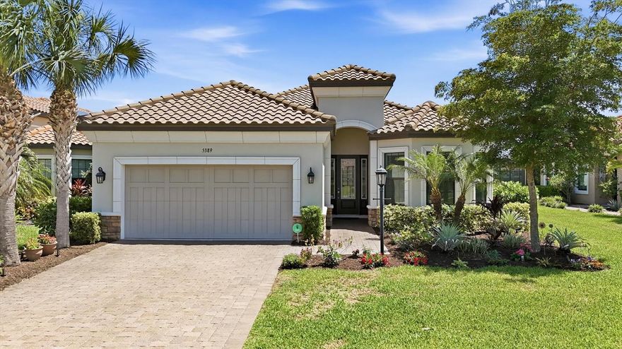 Welcome to luxury resort-style living in the highly sought-after community of Esplanade on Palmer Ranch. This exceptional 3-bedroom plus den Lazio model combines elegant design, smart-home convenience, and extensive high-end upgrades throughout. Designed with both luxury and functionality in mind, the home features hurricane-impact windows and sliders, soaring extended-height ceilings and doors, and an expanded gourmet kitchen complete with a wine fridge, oversized island with second sink, quartz countertops, and abundant entertaining space. Architectural details such as curved wall transitions, crown molding, and porcelain tile flooring throughout elevate the home’s sophisticated feel. The spacious owner’s suite offers an enlarged walk-in closet with a premium custom closet system and center island, while the pantry has also been upgraded with high-end built-in organization. Additional luxury touches include electric shades in the great room, smart home and alarm integration, built-in Sonos surround sound system, comfort-height toilets, and a tankless water heater. Step outside to the extended lanai featuring an outdoor kitchen, creating the perfect setting for entertaining and seamless indoor-outdoor Florida living in one of Palmer Ranch’s most desirable resort-style communities. Residents of Esplanade on Palmer Ranch enjoy a gated, maintenance-free lifestyle with world-class amenities including a resort pool and spa, Bahama Bar, fitness center, tennis, pickleball, bocce ball, walking trails, dog parks, wellness programs, social events, and direct access to the Legacy Trail. Ideally located near beaches, shopping, and dining, this home offers the perfect combination of luxury, comfort, and lifestyle.