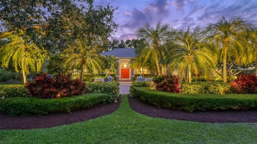 Located in The Landings, one of the very few gated West of the Trail communities that is also a well-established and highly sought-after  Sarasota neighborhood, this custom-built, 2-story home boasts a prime location on a larger, partially fenced quiet cul-de-sac lot, offering additional privacy between neighboring homes and surrounded by mature, lush landscaping. With four bedrooms and an office, this high-quality residence presents an outstanding opportunity for those who seek a harmonious blend of functional space, style and sumptuousness. An oversized circular brick paver driveway and walkway leads to a double-door entry, where just beyond the threshold a flexible, flowing floor plan ideal for sprawling family living or accommodating visitors comfortably and elegantly is unveiled.  The first level features all the main living areas, including the office, a private guest bedroom suite with full bath, a powder bathroom for guests, the exceptionally large dining room, a family room with fireplace and a fully equipped bar, and wood floors that create a warm, welcoming ambiance and compliment the high ceilings with crown molding and recessed lighting.  Also on the main floor is a generous master suite, which includes an extended sitting / study area, two spacious custom-fitted closets plus an en-suite master bath with spa tub, glass enclosed and tiled walk-in shower, and separate make-up vanity with additional sink. The open, white-cabinet kitchen has contrasting solid surface countertops, glass tile backsplash, stainless steel appliances, center island and adjacent breakfast room. French doors lead to an expansive screened pool area, the pool and heated spa. Upstairs are two additional guest bedrooms and bathrooms plus a spacious multi-functional bonus room. Additional features include a side entry 3-car garage with resealed epoxy floor, 3-zone HVAC system new in 2021 and new roof in 2020. The Landings offers residents access to a clubhouse, swimming pool, fitness center, spa and sauna, and eight Har-Tru tennis courts, all just moments from the excitement of downtown.