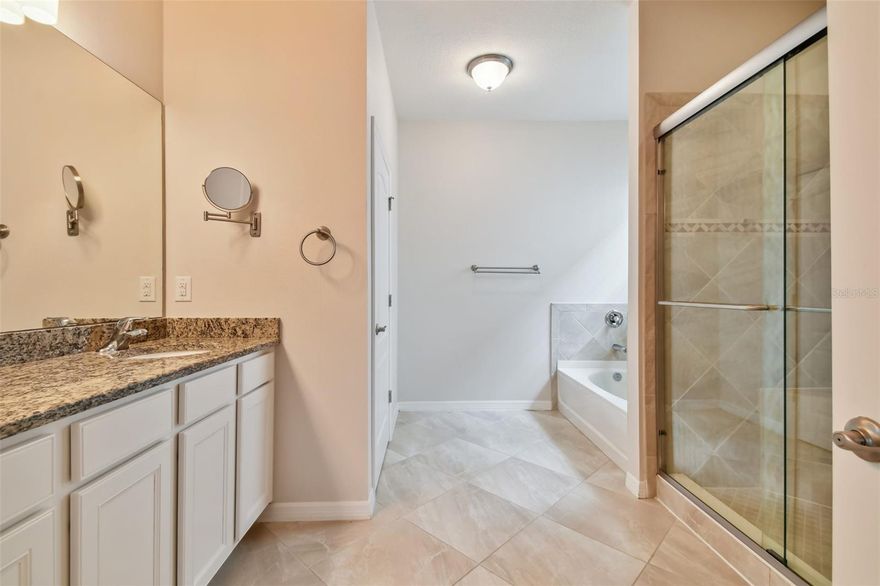 One or more photo(s) has been virtually staged. Welcome to 8112 36th St E — where luxury, comfort, and the best of Florida living come together. Built in 2013 and upgraded with exceptional care, this 3-bedroom plus den, 2.5-bath home offers refined living in University Groves Estates, one of Sarasota’s most peaceful and meticulously maintained communities known for its tile roofs, brick-paver driveways, and warm neighborhood atmosphere.
This home has it all!! * Low maintenance living at its best with HOA-covered landscaping. * Highly desirable location - less than 5 minutes to University Town Center. * Less than 20 minutes to downtown Sarasota. * Less than 15 minutes to Sarasota’s world-renowned beaches. * No CDD fees!  
Inside, an inviting open-concept layout welcomes you with abundant natural light, elegant crown molding, and plantation shutters in the main living areas. The gourmet kitchen serves as the heart of the home, featuring granite countertops, a natural gas range, a large pantry, an island with a built-in reverse osmosis system, and a newer dishwasher (2021). The seamless flow into the dining and living spaces creates the perfect setting for entertaining and everyday living.
The primary suite provides a serene retreat with wood floors, dual walk-in closets, dual vanities, a Jacuzzi soaking tub, and a separate shower with a built-in bench. The den has been beautifully refinished with luxury vinyl plank flooring, fresh paint, and new baseboards, offering flexibility as a home office, guest room, or optional fourth bedroom. Additional upgrades include newer LVP flooring (2022) in all other bedrooms, a new water softener (2024), epoxy-coated garage floor, new garage door opener (2025), newer AC (2020). Additional features include overhead garage storage and an in-wall pest control system.
The showpiece of this home is the screen-enclosed, resort-style pool area, designed for relaxing and entertaining year-round. Surrounded by lush landscaping, the pool features a timeless travertine deck and a covered lanai with a freshly refinished wood tongue-and-groove ceiling, adding a warm, custom touch to the outdoor living space. Backing to a tranquil preserve, the backyard offers privacy, peaceful nature views, and unforgettable Florida sunsets.
Thoughtfully upgraded, impeccably maintained, and truly move-in ready — 8112 36th St E stands out from the rest. Experience the lifestyle for yourself and schedule your private showing today.