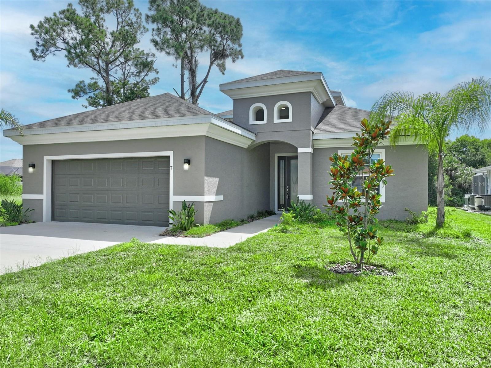 Welcome to this exceptional custom-built pool home situated on a saltwater canal! Built just 1 year ago, this stunning residence features 3 bedrooms + office/den, 3 full bathrooms, a spacious loft, and a 2-car garage—all located on a quiet cul-de-sac with minimal traffic. Step through the grand foyer into a light-filled, elegantly designed interior. The gourmet kitchen is a chef’s dream with quartz countertops, two-toned cabinetry, stainless steel appliances, glass-top electric stove, a huge center island with farmhouse sink, and a wine fridge in the dining nook. The open-concept great room boasts a dramatic architectural ceiling and sliding glass doors that fully open to the screened-in pool area, perfect for indoor/outdoor living. The saltwater pool is just steps from your private boat dock, boat lift, jet dock, and waterside lounge area—ideal for entertaining or simply relaxing by the water. Retreat to the main-level owner’s suite with tray ceiling, dual walk-in closets, and a luxurious en suite bath featuring dual vanities, a freestanding soaking tub and huge walk-in shower. An additional bedroom and full bath on the main level offers a perfect in-law suite setup. The office/den with French doors creates a comfortable work-from-home space. Upstairs, you’ll find a spacious loft with access to a large balcony—perfect as a game room or teen retreat—plus a third bedroom with its own full bath and walk-in closet. This home truly has it all—high-end finishes, thoughtful layout, water access, and unmatched outdoor living. Don’t miss this rare opportunity. Schedule your private showing today and start living the Florida waterfront dream!