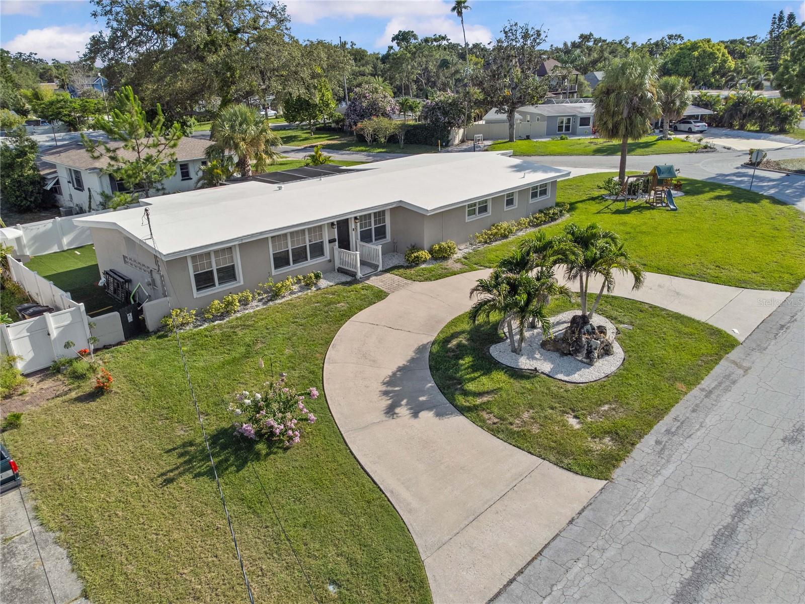 Welcome to this beautifully updated 3-bedroom, 2-bathroom home with a dedicated office and spacious 2-car garage, ideally situated in one of most desirable neighborhoods, Belleair. Priced $25,000 under appraised value for a quick sale and a great deal! Perfectly move-in ready, this striking residence sits on a large corner lot and greets you with a wide circular driveway that provides ample parking and an impressive sense of arrival.
Step inside to discover bright, open living spaces and modern design elements. The inviting living area seamlessly flows into a stunning gourmet kitchen featuring elegant quartz countertops, a classic subway tile backsplash, smooth cooktop range with stainless-steel vent hood, custom wood cabinetry, stainless-steel appliances, and a generous walk-in pantry — ideal for the home chef.
Retreat to the spacious primary suite, complete with an oversized walk-in closet and a beautifully appointed en-suite bathroom showcasing a floor-to-ceiling tiled walk-in shower with sleek frameless barn-style sliding doors.
Outdoors, enjoy the privacy of your expansive vinyl-fenced backyard oasis, complete with a tranquil rock waterfall fountain, newly screened porch, and freshly graded, maintenance-free turf — an upgrade that allows you to spend more time enjoying gatherings, barbecues, and quiet moments with family and friends.
This meticulously maintained home has undergone significant improvements in recent years, including a new A/C system and ductwork in 2021, a new roof, fascia, and soffits in 2017, plus new windows, updated electrical and plumbing systems, reconfigured living areas, upgraded lighting, and remodeled bathrooms and newer appliances.
Nestled on a peaceful street in a NON-FLOOD, non-evacuation zone, this residence offers an outstanding opportunity to join a thriving community just minutes from the Belleair Country Club, Pelican Golf Club, and the world-renowned beaches of Clearwater. This house sits on an elevated lot that has never flooded or had drainage issues.
Don’t miss your chance to make this exceptional Belleair property your new home.
