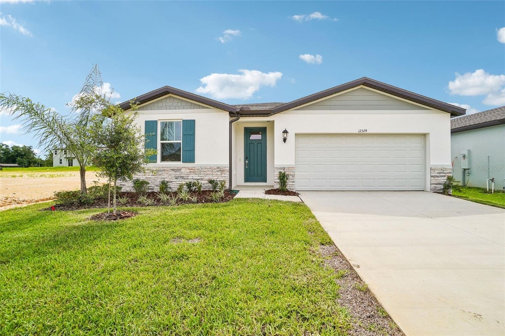 Photo of 12574 Hourglass Way, Dade City, FL 33525 (MLS # TB8501394)