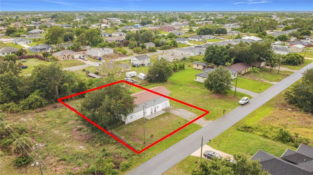 Photo of 3303 6th Street SW, Lehigh Acres, FL 33976 (MLS # O6424869)