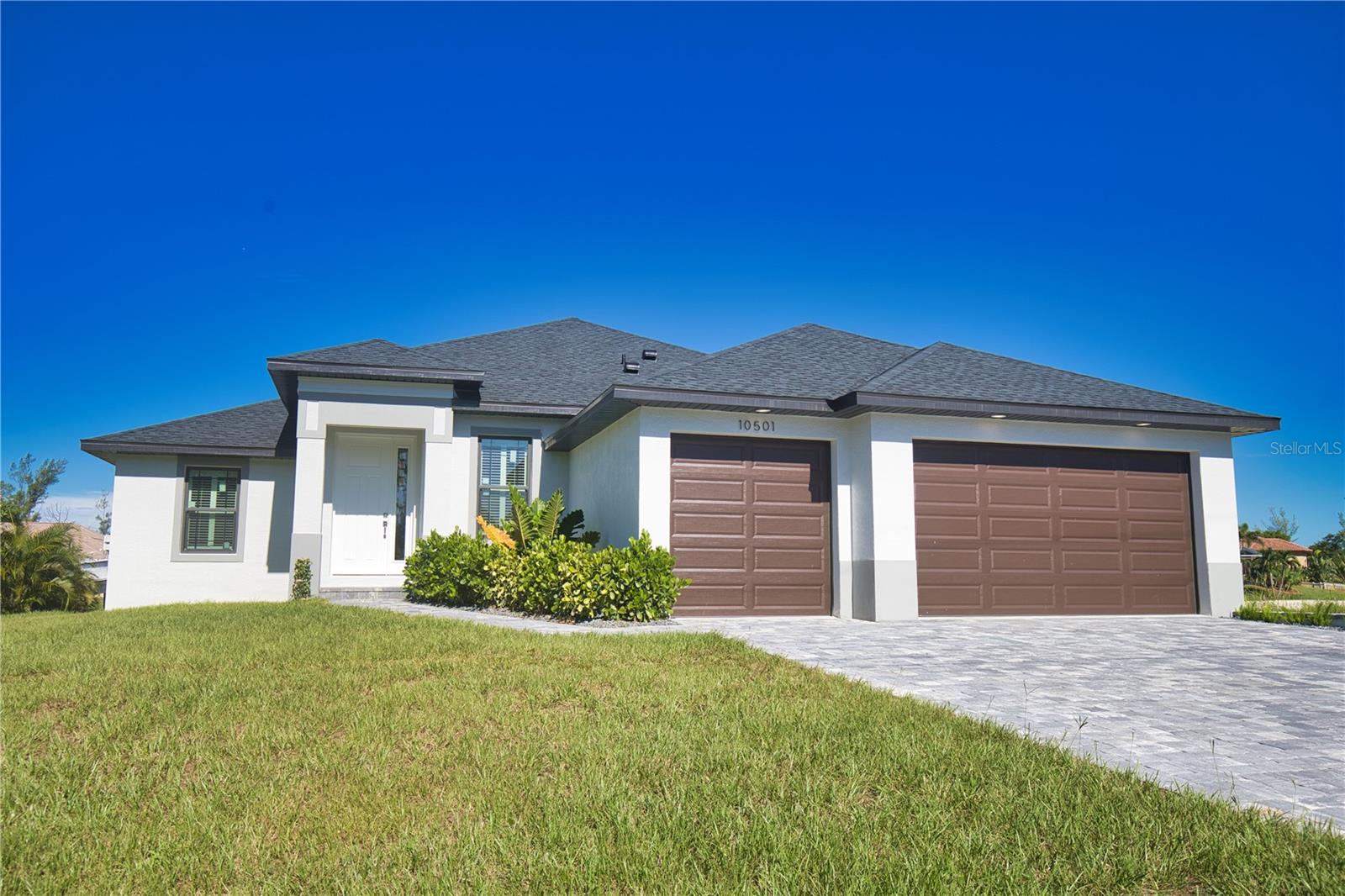 Brand-New Spectacular Waterfront Home with Sailboat Access! This stunning 3-bedroom, 2.5-bath home with a den (or optional 4th bedroom/nursery) delivers the ultimate Florida lifestyle with no-bridge access to Interceptor Lagoon, the Myakka River, and the Gulf of Mexico. The open great room design features tray ceilings with accents in the living, dining, and primary suite, recessed lighting inside and out, 24x48” porcelain tile, impact-rated low-E windows and doors, and plantation shutters.
The chef’s kitchen is a showpiece with a waterfall island with seating, leather granite counters, farmhouse sink, slow-close drawers and doors, glass mosaic backsplash, pull-out trays in the pantry and base cabinets, and above/below cabinet lighting. The primary suite includes dual walk-in closets, a spa-inspired bath with dual sinks, walk-in shower with shampoo shelf, and wood-shelved linen closet, while the secondary bath features a relaxing tub. Bedrooms 2 and 3 also have custom walk-in closets.
Outdoor living is exceptional with a caged pool and smart spa, paver-wrapped deck, 30x12 covered lanai with dual fans and lights, outdoor shower, half pool bath, and a security fence around the screen enclosure. A triple-wide paver driveway leads to a 3-car garage with Garage Trac flooring, fridge with ice maker, wash basin, and extra cabinet storage, plus AC storage off the pool deck. Additional highlights include LED anti-fog mirrors, Swiss Madison toilets with bidet attachments, French doors with inset blinds, large ceiling fans, and a convenient laundry storage area.
Move-in ready and packed with luxury upgrades, this brand-new home is a boater’s paradise—schedule your private showing today!