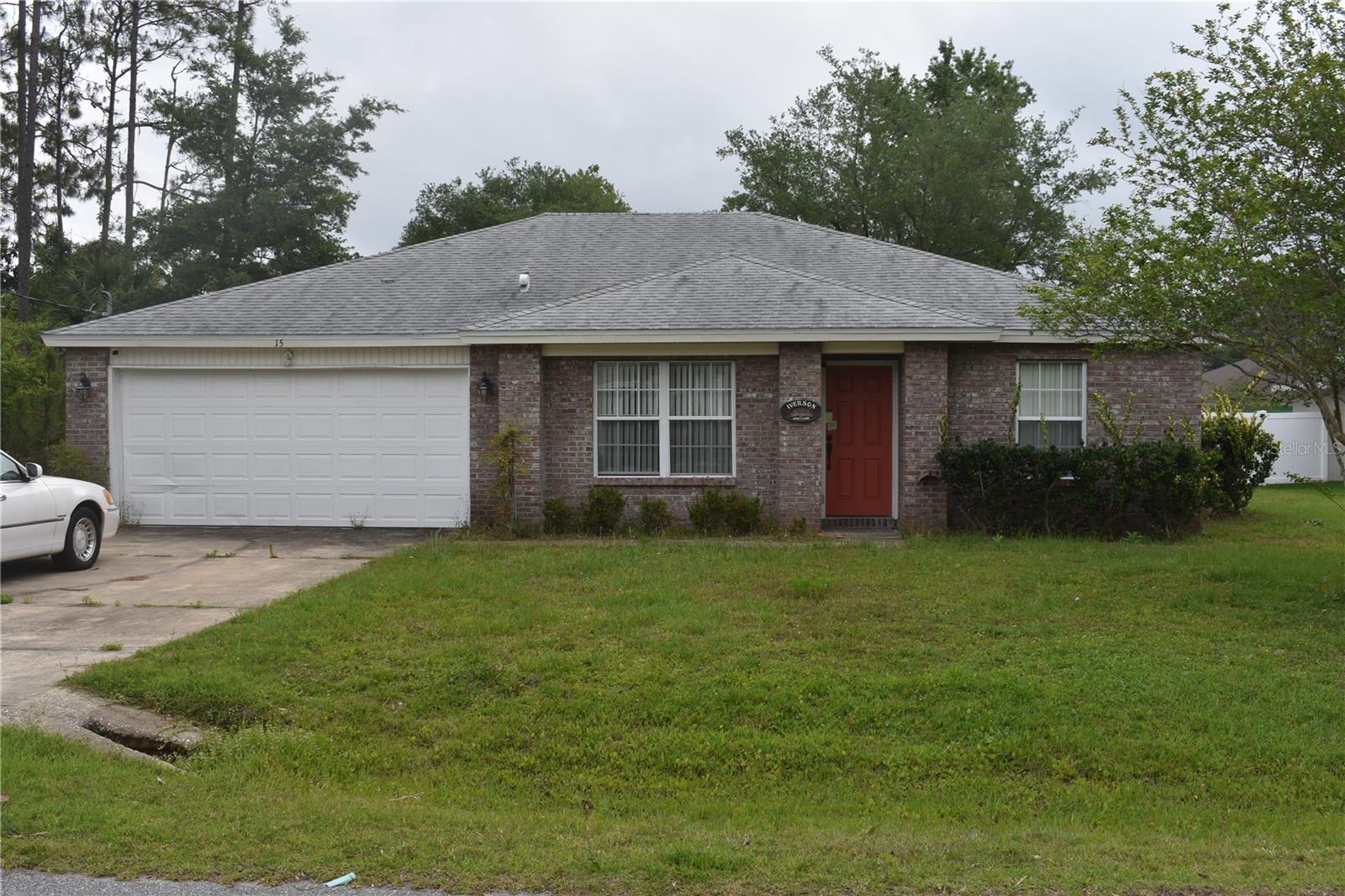 Low maintenance Brick and mortar home in Super Location in the southern end of Palm Coast. Nice cul-de-sac street .Great homes and quick access to all your shopping needs. Nice pattern flow to the home, 3 bedrooms (nice size) on one side with hall bath and owners suite/bath on other side of home. Nice 10x10 patio out back. New roof 2018. Home interior will need repainting. Tile in main areas(hallways, living area and kitchen) as well the bathrooms. Carpet in sleeping areas. Ample cabinets in kitchen and also washer /dryer connections in dinette area .This really is a gem with some elbow grease and fresh paint.Storage cabinets remain in garage and all appliances Love feedback and send all offers. Additional photos pending