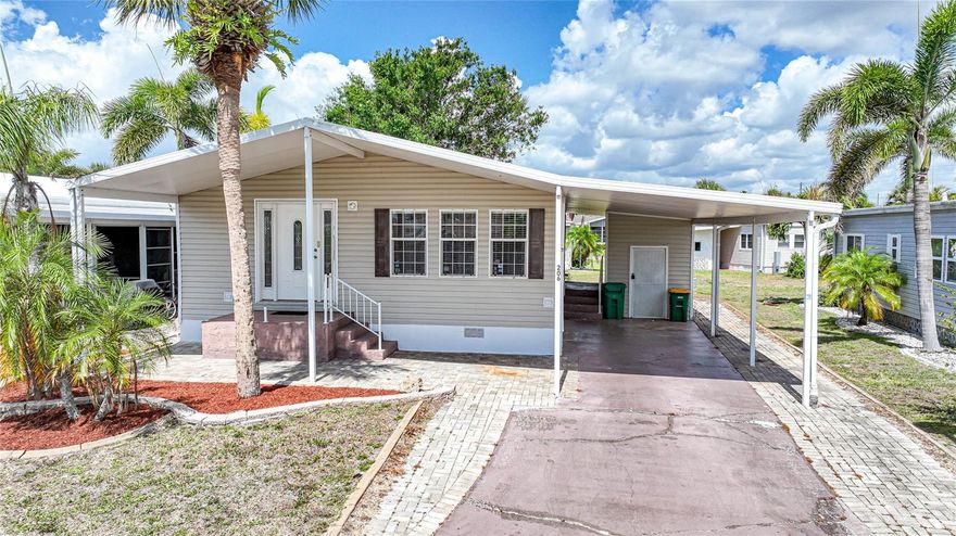 Experience RESORT-STYLE LIVING in this well-maintained 2-bedroom, 2-bathroom manufactured home with a 2-space carport, located in the highly desirable Maple Leaf Estates, a premier 55+ community. Whether you're searching for a seasonal retreat or a full-time residence, this home offers comfort, space, and an active Florida lifestyle.

RESIDENCE OVERVIEW:
• 2 Bedrooms | 2 Bathrooms
• 2-space covered carport
• Bright, open floor plan
• Spacious bedrooms with ample closet space
• Ideal for seasonal or year-round living

INTERIOR FEATURES:
• Open-concept living and dining areas
• New carpet throughout
• Indoor laundry room for added convenience
• Light and airy layout designed for comfortable living

CULINARY SPACE:
• Large kitchen with center island
• Ample cabinetry and counter space
• Functional layout ideal for everyday use and entertaining

PRIVATE OWNER’S RETREAT:
• Generously sized primary bedroom
• Plenty of closet space
• En-suite bathroom featuring:
– Dual sink vanity
– Built-in makeup/vanity area
– Walk-in shower

GUEST ACCOMMODATIONS:
• Spacious guest bedroom
• Nearby full bathroom
• Comfortable setup for family and visitors

OUTDOOR & EXTERIOR FEATURES:
• Large covered carport
• Utility shed for additional storage
• 2023 roof for added peace of mind
• Low-maintenance exterior

COMMUNITY AMENITIES:
• 18-hole golf course
• Tennis, pickleball, bocce ball & shuffleboard courts
• 4 heated pools & 2 hot tubs
• Fitness center & woodworking facility
• On-site restaurant & Tiki bar
• 75+ clubs, social activities, and events

ADDITIONAL HIGHLIGHTS:
• Share certificate included in price
• Active, resort-style 55+ community

LOCATION PERKS:
Conveniently located near US-41 and I-75 with easy access to Downtown Punta Gorda, Fishermen’s Village, Ponce De Leon Park, shopping, dining, and live entertainment.

Don’t miss this opportunity to enjoy maintenance-friendly living with world-class amenities—schedule your private showing today!
