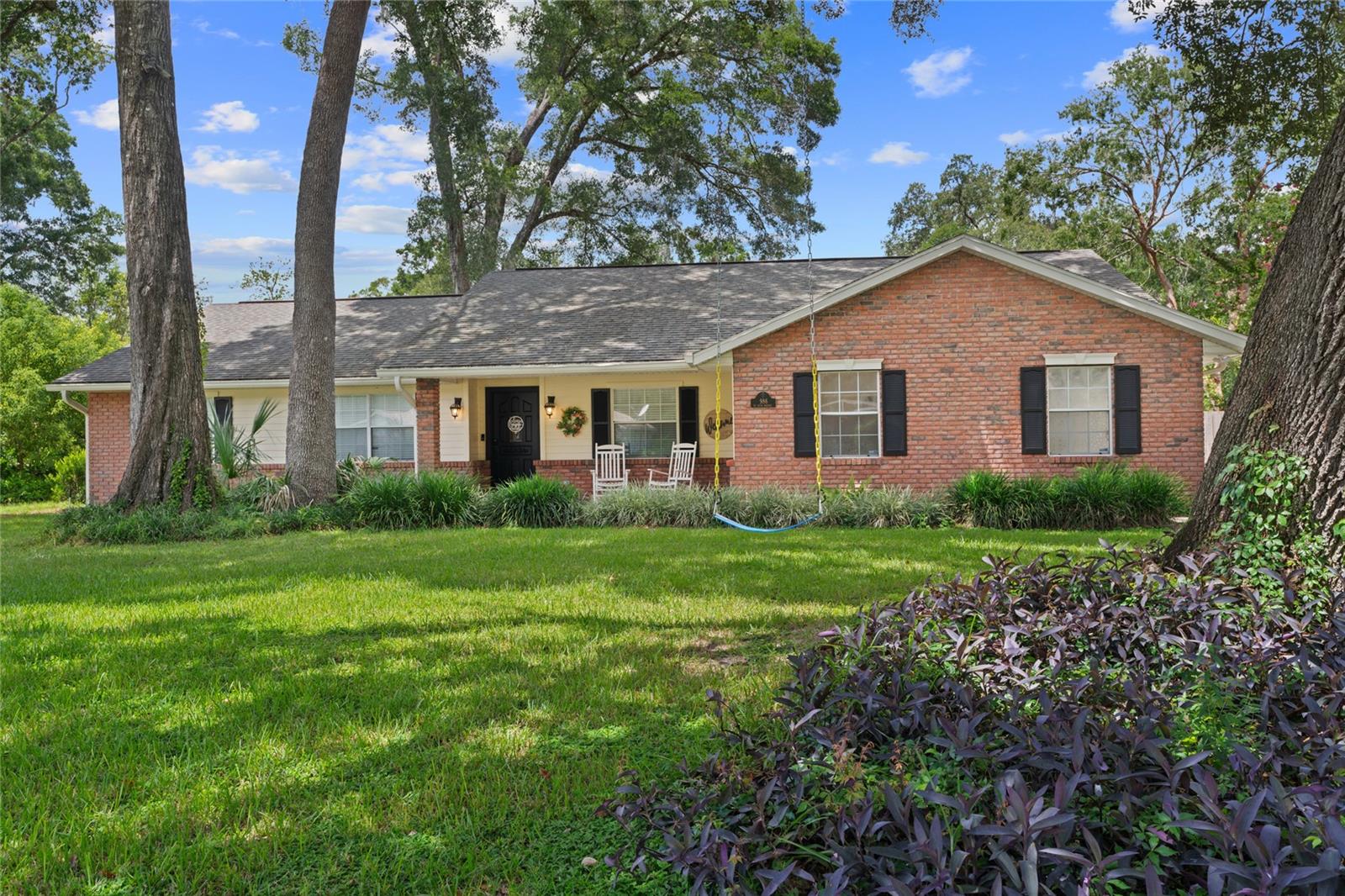 Welcome to this beautifully maintained home in a highly sought-after Southeast Ocala neighborhood, where a canopy of mature oak trees frames the street and adds to the home's fabulous curb appeal. This property offers the perfect blend of charm, space, and smart upgrades. Step inside to find a formal dining room, spacious office/den, and an inviting living room with vaulted beam ceilings and a cozy wood-burning fireplace. The updated kitchen features Corian countertops, a pantry, and nearly new appliances: gas range (2021), refrigerator (2023), microwave (2021), and dishwasher (2024). Enjoy the added touches of a butcher block counter in the breakfast nook and ample built-ins throughout the home. Smart home-ready with a Nest thermostat, routed fiber-optic internet, and Ring doorbell in place. The HVAC (serviced every 6 months) and roof are well-maintained, and the garage door was replaced in 2022. 3 spacious bedrooms, including a generously sized guest room, and double-vanity bathrooms with glass-enclosed tile showers. The guest bath offers backyard access—perfect for future pool plans (already permitted with the city!). Laundry room off garage, tons of storage, and washer/dryer convey. The lanai is AC-ready for future enclosure, and the entire backyard is secured by a 6” fence installed 3 years ago. Termite bond with HomeTeam Pest Defense is current and serviced quarterly. We can't wait for you to fall in love with this home.