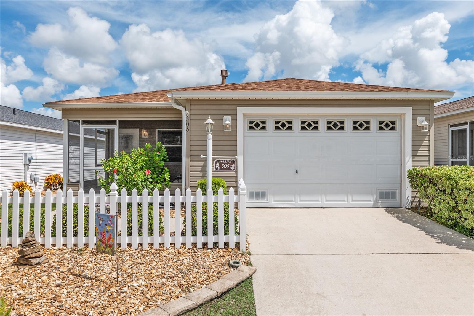 **BOND PAID!** Welcome to this Beautifully Maintained 2/2 Colony Patio Villa, perfectly situated in the sought-after VILLAGE OF CAROLINE. This home truly shows like a dream, offering a quiet neighborhood setting with friendly neighbors and exceptional curb appeal. The low-maintenance landscaping frames the home beautifully creating a welcoming first impression.Inside, you’ll find a bright, neutral interior with vaulted ceilings throughout, enhancing the open and airy feel. The main living areas feature updated LUXURY VINYL flooring for a stylish and low-maintenance touch. NATURAL GAS ready for both cooking and heating. New Dishwasher/2024 & Updated Refrigerator. INSIDE LAUNDRY only adds to the convenience and appeal of this home. **PRIME LOCATION!** Terrific CENTRAL locality in this vibrant and active 55+ Golf Community with countless amenities! Positioned "BETWEEN THE 6's" & only 1.4 Miles (6 minute golf cart ride) from popular Lake Sumter Landing Square. Close to Mallory Country Club, Caroline Village POOL, very near to shopping, restaurants, nightly LIVE MUSIC entertainment, recreation centers, churches, medical, golf, as well as numerous other conveniences. Don’t miss your chance to own a piece of paradise in one of Florida’s most desirable communities! HVAC/2020. ROOF/2022. BOND PAID!