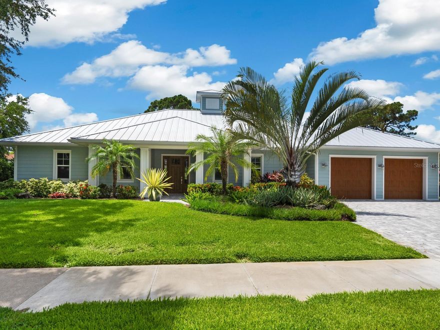 This custom-built coastal contemporary home on Venice Island is a dream come true, perfectly blending luxury with practicality to create an inviting oasis. From the moment you step inside, the seamless integration of indoor and outdoor living spaces sets the tone for a relaxed and comfortable lifestyle. The great room, with its pine wood vaulted ceilings, creates a sense of openness and airiness, while the central hub kitchen, featuring a large island, becomes the heart of the home where family and friends can gather and connect. This cohesive layout encourages both practicality and socializing, making it an ideal space for everyday living and entertaining. A private primary suite, with its tray ceilings, double walk-in closets, oversized primary bath, and private entrance to the outdoor oasis, provides a tranquil retreat for relaxation. There are two en-suite bedrooms which offer privacy and comfort for family or guests. Practical amenities like the office/den, large pantry, laundry room, and spacious two-car garage with extra storage add to the functionality of the home. In addition to the many interior design features, hardwood floors, ceiling fans, and plantation shutters, the PGT hurricane impact windows and doors, and a propane-heated saltwater pool, spa, and outdoor kitchen, make this home not only beautiful but also built to withstand the elements and provide ample opportunities for leisure and entertainment. And let's not forget the prime location near downtown Venice and a short walk to the beach, offering the convenience of nearby attractions while still maintaining a sense of privacy and seclusion. Overall, this home truly seems like a slice of paradise that offers the best of coastal living.