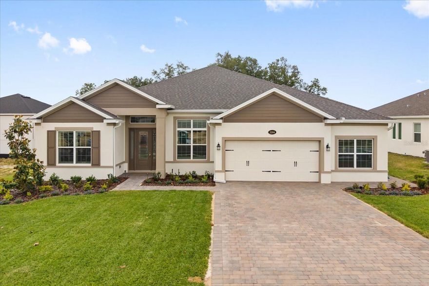 Located in the gated community of Wolfe Lake Ranch.  This home is perfectly positioned on one of the best lots in the entire neighborhood, sits high on a hill with no rear neighbors, offering both privacy and serene views.

From the moment you arrive, the extended paver driveway and custom shutters set the tone for the thoughtful upgrades found throughout. 

The floorplan is both functional and inviting. Enter through the foyer to find a formal dining room on your right and a versatile flex space on your left. Perfect for a home office, playroom, or additional living area. The kitchen overlooks the spacious main living area and dinette, with beautiful sliding glass doors that seamlessly connect indoor and outdoor living.

Every detail has been carefully selected. Porcelain Onyx tile flows through the main living areas, complemented by plush, extra-padded carpet in the bedrooms for added comfort. The kitchen is truly the heart of the home, showcasing a gas stove, quartz countertops, double oven, speed cook microwave, hot water dispenser, custom backsplash (carried onto the island and drop zone), and upgraded pull-out drawers in the kitchen, bathrooms, and laundry, combining style with functionality. Crown molding elevates the main living spaces.

The primary suite is a true retreat with elegant crown moulding and tray ceilings.  Plus a door that leads to the patio.  Large bathroom featuring dual vanities with plenty of storage soaking tub + shower, two large closets, and a linen closet. The split floorplan offers privacy, with three additional bedrooms located on the opposite side of the home.  Two of the bedroom are connected by a spacious convenient Jack and Jill bathroom. There is also an additional full bathroom just off the fourth bedroom and provides direct access to the patio—ideal for guests.

The backyard is designed for both relaxation and entertaining, featuring an extended patio with a screen enclosure.  Custom shelving and built-in bar for your own private outdoor retreat. The home is also prewired for security cameras. Includes added irrigation in the rear for easy maintenance. Plus low voltage lights in the front and back of the home to highlight the landscaping. Garage includes an extended storage area ideal for a workshop, home gym, or additional storage space.

This home offers the perfect blend of thoughtful design, high-end upgrades, and a premium lot—ready for you to move in and enjoy from day one.