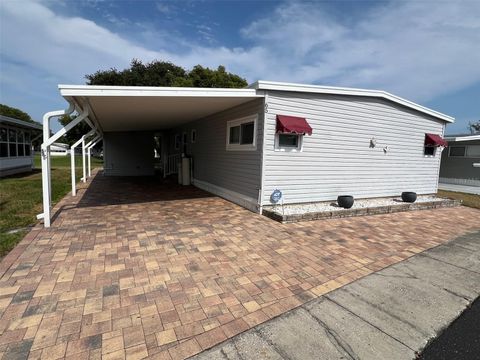 Photo of 65 Sabal Palm Drive, Largo, FL 33770 (MLS # TB8383567)