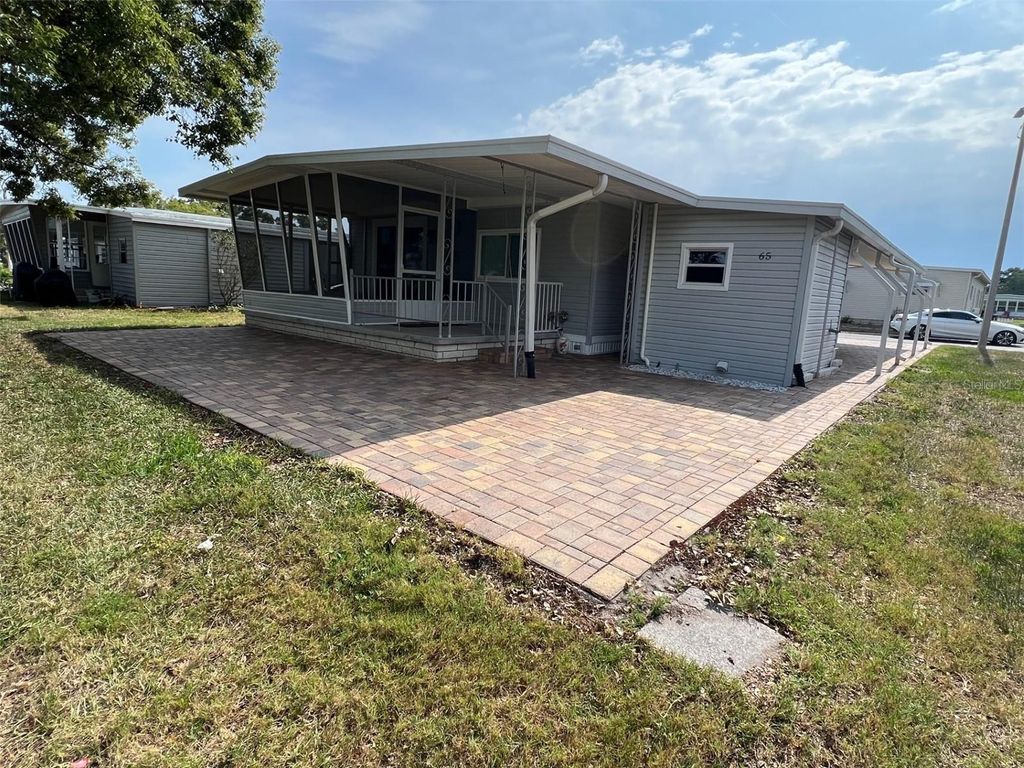 Photo of 65 Sabal Palm Drive, Largo, FL 33770 (MLS # TB8383567)