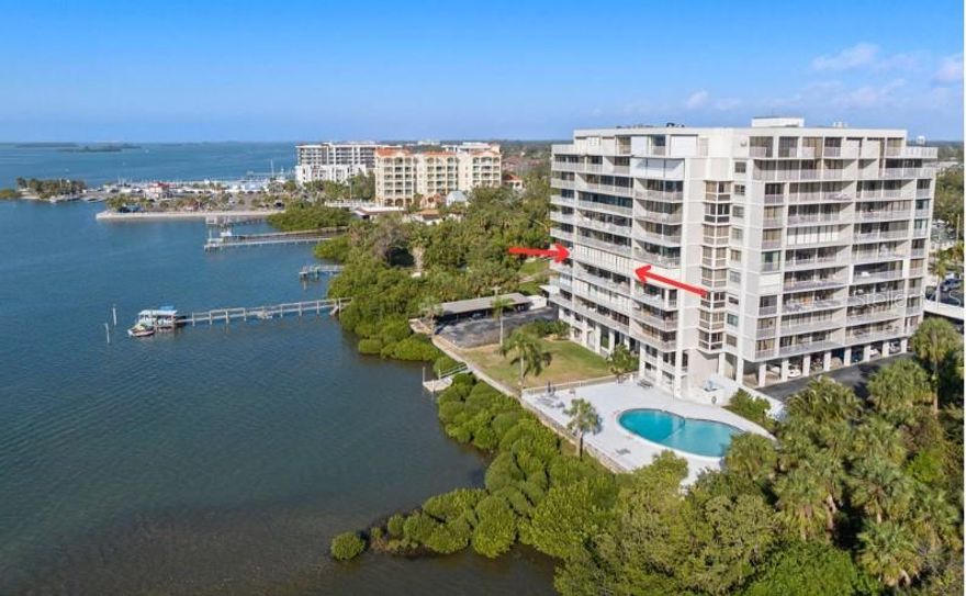 Rare 2 Bedroom 2 Bath Open Waterfront View at Harbor Bluffs Waterfront in downtown Clearwater. The balcony overlooks St. Joseph's Sound Intercoastal Waterway from the entire length of this spacious 4th floor unit from every room with floor to ceiling windows in both bedrooms and living room. Enjoy waterfront breezes while entertaining or watching wildlife, boaters and gorgeous sunsets. Harbor Bluffs is a gated waterfront condo building with 2 elevators, an interior courtyard, fitness center, pool, dock and clubhouse, all overlooking the Intercoastal. One designated storage room on the 1st floor also conveys as well as one covered parking space. There is also guest parking. Kitchen is well equipped with an electric Kenmore Elite range that offers 2 ovens for baking, as well as a convection setting. Privacy is at a premium with a split bedroom floor plan and 2 separate entrances to the unit. Primary bedroom boasts dual closets and an ensuite bathroom with a walk-in shower. This property is located near vibrant downtown, home to Ruth Eckerd’s Capital Theater and Coachman’s Park Sound Venue, both with worldwide top performers. Listen to entertainers perform from the Sound Venue FROM THE COMFORT AND PRICACY OF YOUR BALCONY! Downtown has many popular delectable restaurants, as well as fabulous shopping, the Clearwater library, several banks, Clearwater Court House, Clearwater downtown Marina, Seminole boat ramp and Clearwater Playhouse. All within a short walking distance from Harbor Bluffs Condominium. Famous Clearwater beach is just over the Clearwater Memorial Causeway, as well as the Clearwater Aquarium, home to Winter and also the popular Island Way Grill Restaurant. Enjoy walks on the beach, sunsets, entertainment and other famous restaurants on Clearwater beach. Only a short drive to Dunedin, Tarpon Springs, Tampa and St. Petersburgh. Experience a tranquil lifestyle at Harbor Bluff with excitement around every corner. New electrical panel 2023, HVAC 2023. LG Thin Q front loading washer and dryer convey with purchase.