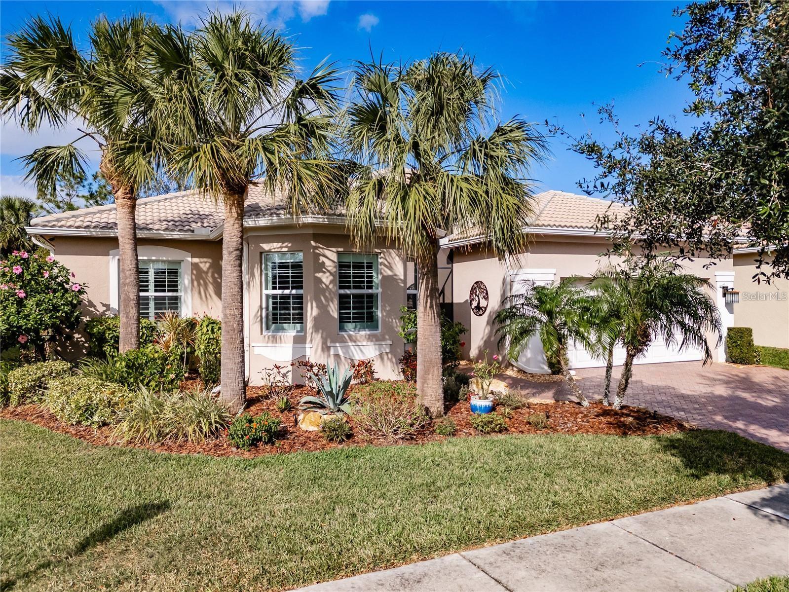 If you desire an exceptional house in an exceptional community, here it is. This 2,180SF LIVORNO model has 3 bedrooms, a Great Room, Dining Room, and Kitchen with a Dinette. Oh, did I mention that this LIVORNO has a spectacular backyard with a gorgeous pool. Built by GL Homes in Valencia Lakes, in Tampa Bay's premier 55+Active Adult Community, this is a house that you will be unreservedly proud to call home. Beyond the screened-in front Portico, are beautiful etched-glass French Double-Doors leading into the Foyer with porcelain tile framed by marble borders, and a 15' ceiling. The open floorplan is anchored by an expansive Great Room which features a double-tray ceiling and has a commanding view of the Dining Room, Kitchen, Lanai and pool. The Kitchen is spectacular. Luxury granite counters adorn prime 42” solid-wood cabinetry: lower cabinets are soft-close pot drawers & upper cabinets have undermount lighting & soft-close doors. The discerning Chef will love the LG ThinQ range with convection oven, the LG ThinQ microwave with extendable range hood, the SAMSUNG three door fridge, and a near-silent Kitchen-Aid dishwasher. The Dinette is perfect space for casual or intimate meals and features a custom dry bar. The Master Bedroom features a 10’-to-11’ Tray ceiling, a full-length glass door to the Screen Room, engineered hardwood floors, 2 bespoke Walk-In Closets and a gorgeous Ensuite Bathroom with a W/C for the Commode. The no-step shower has floor-to-ceiling porcelain tile. The 2 separated vanities are capped by luxury granite counters and a stunning mosaic-glass backsplash. Bedrooms 2 and 3 are at the opposite corner of the house, have lots of natural light, and provide both privacy and great comfort. The second Bathroom features Italian marble tile walls, a glass-enclosed shower with 2 showerheads, and a cabinet vanity with luxury granite. The Laundry Room features washer, dryer and a cabinet vanity with an uber-lux granite counter and utility sink. All common areas feature exquisite over-sized porcelain tile, crown molding, LED recessed lighting and modern light fixtures and windows throughout are adorned with plantation shutters. The front French Double-Doors and the Master Bedroom door feature GRABER dual shade blinds. This home is amazingly well-appointed. The garage is 20’x20’ and has a superior epoxy floor and lots of overhead storage racks. Environmental comforts are provided by a 4-Ton TRANE HVAC with humidity controls, a new HALO Ultimate Salt-Free water-softener system, a new STATE 50-gal water heater with pressure-relief tank, and the Kitchen has a Water Filtration System. The backyard is a space to behold. The extended Screen Room spans the full 61’ of the house and is home to a 27’x18’ lighted gunite pool that was resurfaced and tiled in Spring 2022 and is equipped with an automatic in-floor pop-up cleaning system, solar panel heating, a new pool pump and salt-water chlorinator, and a new PENTAIR Clean & Clear Filter was installed in 2024. Elaborate pavers surround the pool and create a large pool deck for casual times and a 22’x8’ covered Lanai from which you can watch your favorite events on the exterior wall-mounted tv. This LIVORNO model is exceptional. Seize the day and start living your idyllic life with the knowledge that you have earned this treasure. Furniture indoor and outdoor is negotiable. Note: The Bistro by Mattison's is scheduled to open in Fall 2025. Seize the day!