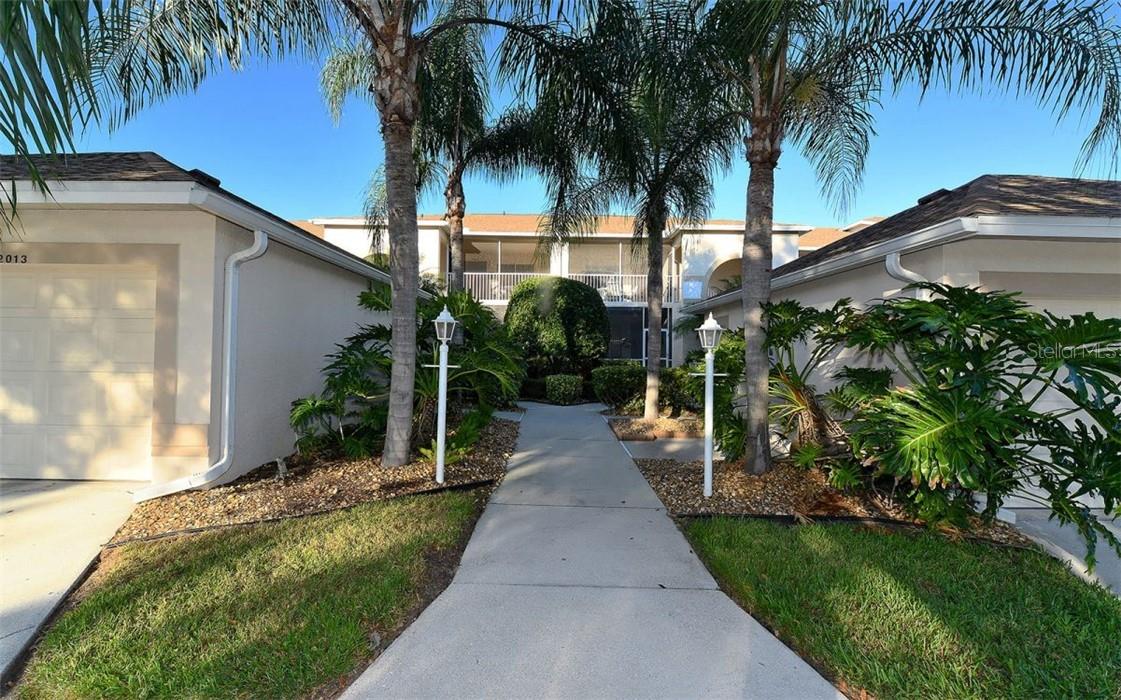 AVAILABLE FOR OFF-SEASON RENTAL MAY - NOV 2025 - BEAUTIFULLY UPDATED KITCHEN AND BATHS, absolutely immaculate vacation veranda in Stoneybrook Golf & Country Club, one of the areas finest golf course communities. This sparkling gem invites you to enjoy the delightful view from the lanai of the lake and 18th green. There is a king-sized bed in master suite and a queen in the guest bedroom. Both bathrooms have been beautifully updated. Open floor plan, plenty of dining area, cozy breakfast nook, and you are sure to love the newly renovated kitchen. The lanai has been enclosed allowing all-weather use. Stoneybrook offers something for everyone: biking, walking, tennis, swimming, and, of course, golf. The golf course modernization was completed in January of 2025 and said to be one of the finest courses on the West Coast of Florida. The impressive clubhouse features fine and casual dining. All this and just minutes to Siesta Key beaches, shops, and restaurants. The golf membership transfers for a fee (check with the administration office for fee schedule.) Call for off-season rates.
