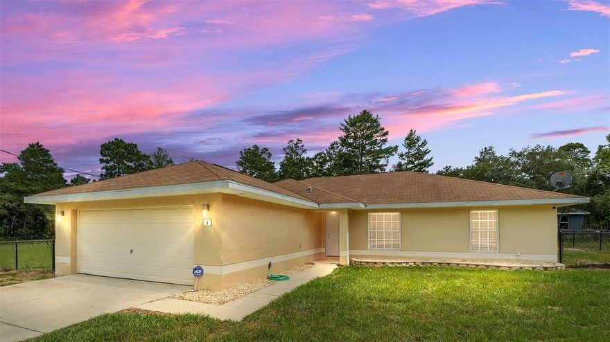 Welcome to Silver Springs Shores! Your search is over. This beautiful Block and Stucco home has four bedrooms, two bathrooms, and a two-car garage, all sitting on two lots in Ocklawaha, near many lakes and ponds. The interior layout features an open-concept living room, dining room, and kitchen. In the foyer, you will find beautiful details in tiled flooring. The spacious living room/dining room features French doors to the outside, diagonally laid out tiles, vaulted ceilings, ceiling fans, and tasteful lighting. The gorgeous kitchen features granite countertops, a built-in double oven, stainless steel appliances, beautiful wooden cabinetry, under-cabinet lighting, a stunning tiled backsplash, and a breakfast bar. The split bedroom layout offers a large owner’s bedroom suite and bathroom. The owner’s bathroom has a dual sink, granite vanity countertop, upgraded cabinetry, a bathtub with massage jets, a walk-in closet, and a linen closet. The shower is an oversized two-person walk-in mosaic with a detailed tiled shower with two shower heads. On the opposite side of this home are two bedrooms and a Guest bathroom, which feature an equally luxurious granite countertop & cabinetry with a beautifully tiled shower. Another guest bedroom is located by the foyer and features French doors and wood flooring. The kitchen has an entrance to the inside laundry room, where you will find a brand-new washer and dryer, the same beautiful cabinetry, and the entrance to the two-car garage. You will find a considerable carport with a shed on this fenced, oversized lot. There are many lakes around where you can enjoy outdoor activities such as kayaking, fishing, and more.