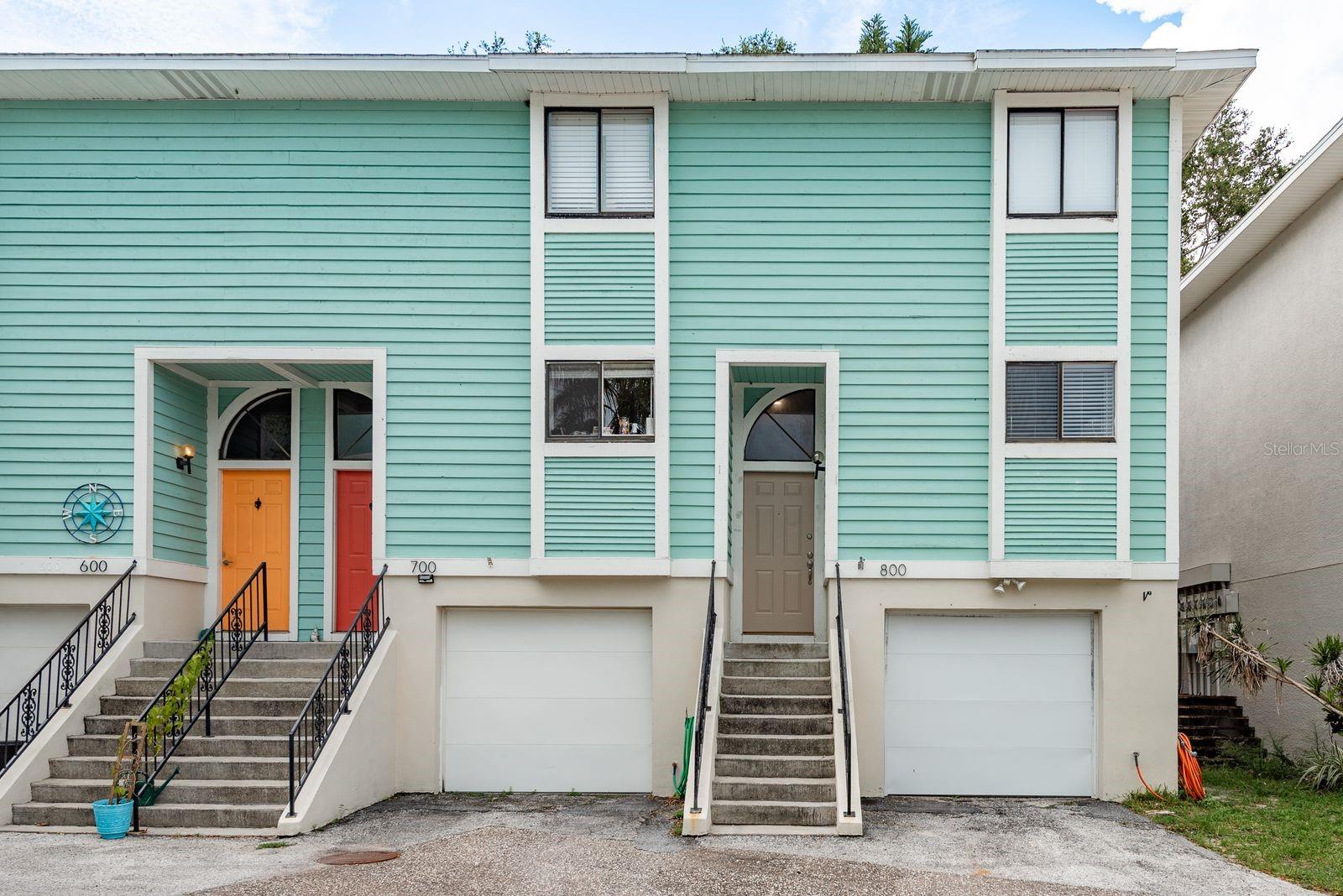 Welcome to 639 Michigan Boulevard, a spacious two-bedroom, two-and-a-half-bathroom townhouse located in the highly sought-after waterfront City of Dunedin. Enjoy the convenience of being just minutes away from stunning waterfront views and all the amenities Dunedin has to offer. As you enter the small yet quiet neighborhood, you’ll notice the Key West-style charm the building shows. Enter through your private garage, or the front door, and you are greeted with a three-level floor plan with the main level being on the 2nd floor. On this level is recently updated vinyl flooring throughout. To your right is the large kitchen, with all recently replaced 2025 stainless steel appliances, great storage, and a large peninsula with countertop seating. This flows into the dining space, both of which are great for entertaining. On the opposite side of the home is your sunlit-filled oversized living room featuring a fireplace and sliding glass doors that lead out to a deck overlooking the backyard. In between the living spaces, you will find a convenient half bathroom for guests. If you head upstairs, you will notice the convenient washer and dryer located next to the bedrooms. The primary suite has two sizable closets, as well as an en-suite bathroom with tile walk-in shower. Opposite is the guest bedroom, which is similar in size, also with an en-suite bathroom with an updated marble vanity and shower/tub combo. Down on the ground level off of the garage is a tiled bonus room (not included in the square footage!) with access to the fenced-in backyard. This space is perfect for a home gym, office, art studio, and more. There is also an abundance of storage space located on this level. Voted one of the best small towns in the south by Southern Living Magazine in 2023, the historic City of Dunedin has so much to offer. From white sandy beaches at the nearby award-winning Honeymoon-Island State Park to the bustling main street of downtown where culture and art flourish, Dunedin has endless festivities, amenities and things to do. The famous Pinellas Trail, the Fine Arts Center, Dunedin Community Center, Golf Clubs, restaurants, craft breweries, and boutique shops are just a few of the things that make Dunedin so special. Take a stroll down the street to Highlander Park, a multi-use recreation area featuring a community center, Highlander Pool, sprayground, 3-playgrounds, picnic pavilions, tennis & pickleball courts, basketball courts, sand volleyball court, and a baseball/softball little league field. There is also the beautiful Hammock Park, offering walking trails, wildlife, and a kayak launch site. All of this and more is accessible by legal golf carts. Don’t miss out on this amazing opportunity to live in a piece of paradise in this rapidly growing and popular Florida town.