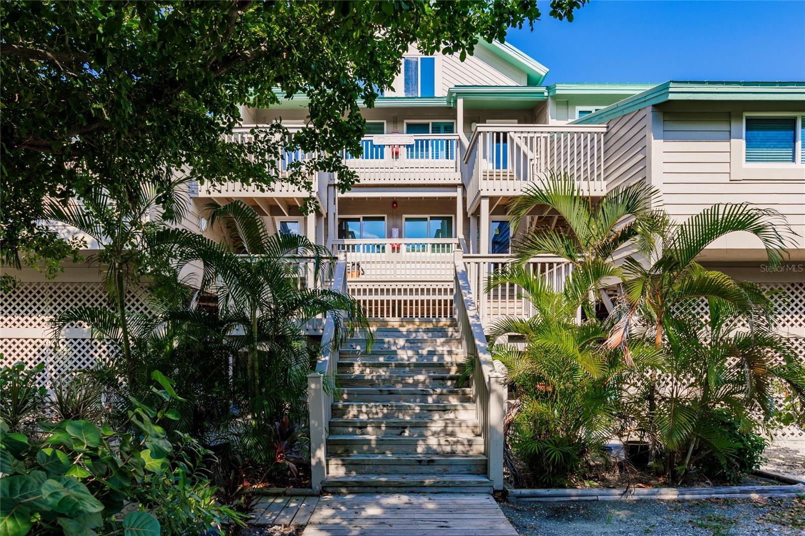 Take in the vistas of the Gulf of Mexico while enjoying a little piece of paradise and solitude on Little Gasparilla Island, which has seven miles of sandy coastline. This 1 bedroom, 1 bath condo is being sold turnkey...........all you need is your toothbrush! Impact windows and sliders installed in 2024, new A/C & hot water heater in 2023. When you feel the need, you can travel to the mainland thanks to private ferry access. Located on Little Gasparilla Island, Placida Beach is a small community of thirty condominiums that runs along the Gulf and Intracoastal. Full access to the Placida Harbour Club facilities, which include three clubhouses, pools, tennis, pickle ball, fitness center, and numerous planned events, is granted to owners. This condominium includes an assignable boat slip at Placida Harbour Club for an additional fee, a marina on the mainland. Placida Beach combines beachfront living with private ferry access to the mainland, giving you the best of both worlds.