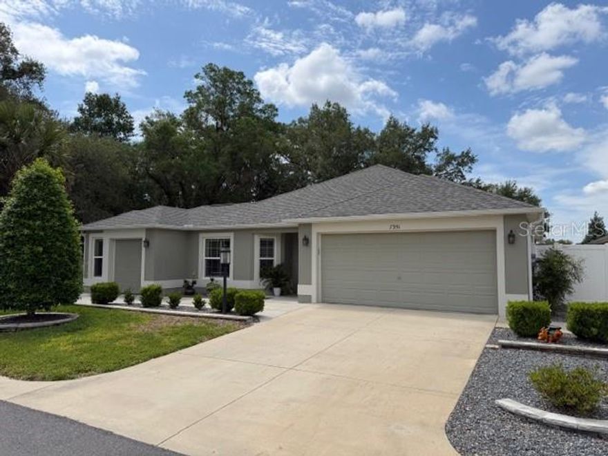 Located at 7351 SE 169th Cote Loop in the desirable community of The Villages, this beautifully maintained Summerville 3 Designer home offers a blend of comfort, quality upgrades, and the signature lifestyle The Villages is known for. From the moment you step inside, you’ll appreciate the bright, open layout designed for everyday living and effortless entertaining. Spacious living and dining areas flow seamlessly together, filled with natural light. The thoughtfully designed kitchen features granite countertops, a glass tile backsplash, Whirlpool appliances, ample cabinetry, and generous workspace—ideal for entertaining or enjoying a quiet evening at home. The primary suite offers a spacious retreat with a Roman shower and generous closet space, while additional bedrooms provide flexibility for guests, a home office, or hobbies. Enjoy a peaceful setting overlooking Amberwood Golf Course #3. The outdoor living space features a solar-heated saltwater pool enclosed by a birdcage, along with a lanai enhanced by an electric awning for shade and comfort. The yard includes two gated entrances for added convenience and privacy. Additional features include a two-car garage plus a golf cart garage. Professionally cleaned and sealed grout reflects the care and attention given throughout the home and contributes to its lasting appeal.