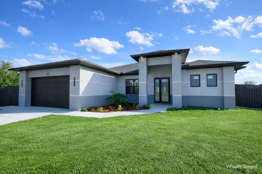 One or more photo(s) has been virtually staged. New Construction with SWIMMING POOL and PRIVACY FENCE. Check out this 4 bedrooms, 2 bathrooms with CITY WATER AND SEWER connected, HIGH Ceilings, IMPACT WINDOWS, OPEN CONCEPT kitchen with wood cabinets and QUARTZ countertops on a CORNER LOT. STAINLESS STEEL kitchen appliances included. This home has an open floor plan, PORCELAIN TILES floors throughout the entire home and EPOXY GARAGE Floor. NOT IN A FLOOD ZONE. Schedule your showing today and come see this beautiful home! Very easy to show. Some pictures are virtually staged or from a sister house model. Don't miss this great opportunity and schedule your showing today!