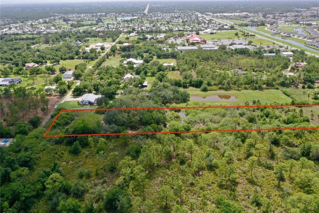 Photo of 24630 Tangelo Ave, Port Charlotte, FL 33980 (MLS # C7511134)