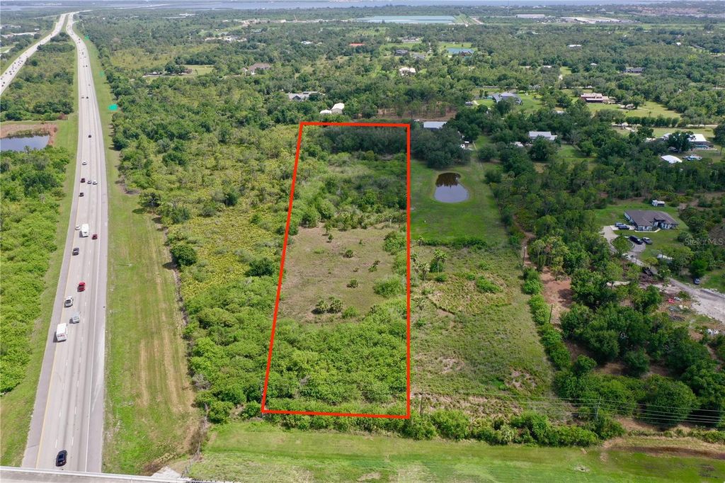 Photo of 24630 Tangelo Ave, Port Charlotte, FL 33980 (MLS # C7511134)