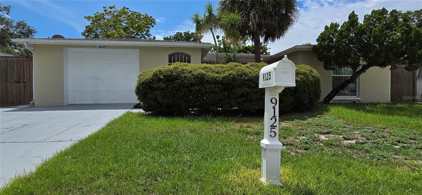Pool Home! Move in Ready! Beautifull and Large 3-bedroom 2-bathroom, single-family home with a great layout with over 2110 square feet of living area with a large car garage with washer and dryer included and its hookups. Two living rooms, two dining rooms, one walking closet located in the master bedroom, a metal gated entry with a portal with private view with some palms on the entry way and cemented driveway for car parking's at front. Home features a kitchen with an island, stainless steel appliances and a pantry. Tile flooring throughout the kitchen, the two living areas, the two dining rooms, bathroom closed to the kitchen, and vinyl plank flooring in all three bedrooms. The pool has a new pump, is screened, enclosed and is very well maintained with lights to enhance its beauty at nights. Roof, HVAC system, electric box, water heater, plumbing, is all in great working conditions with no issues and property is now completely fenced! New garage door and new garage opener. No flood zone, No HOA, located in Port Richey Florida, close to US 19, short drive to Cities like Tampa, Clearwater, St Petersburg, and Orlando.