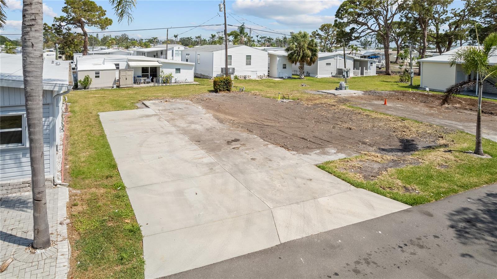 Welcome to a rare opportunity to own a vacant lot in a well-maintained, active 55+ community—perfectly suited for your future manufactured or mobile home. Placed in a quiet and friendly neighborhood, this spacious lot offers a blank canvas to design the retirement retreat you've always envisioned. Located only minutes from the stunning island of Anna Maria where you can experience unforgettable sunsets, dining, boating, shopping and much more.
Enjoy the benefits of low-maintenance living with access to community amenities such as a clubhouse, swimming pool, shuffleboard courts, tennis courts and planned social activities. Whether you're looking to settle down full-time or create a seasonal getaway, this location offers convenience, comfort, and community.