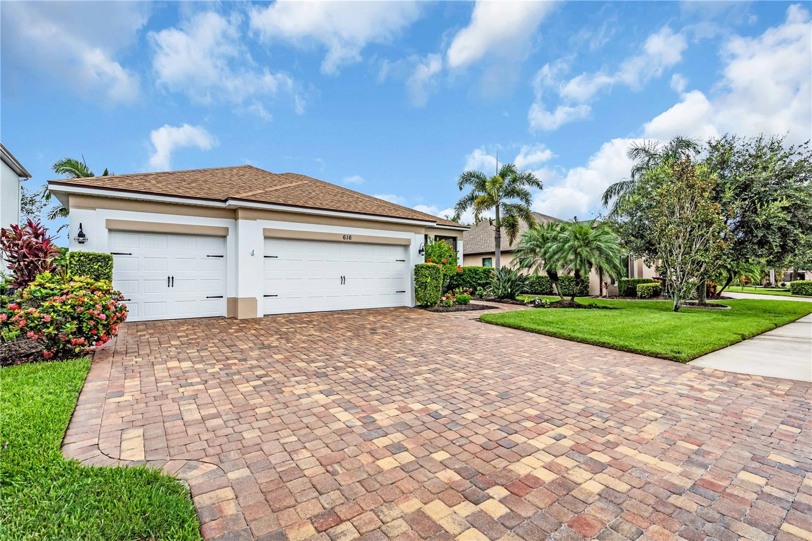 Welcome to 616 Dogwood Run, set against the serene beauty of a protected Florida nature preserve in Greyhawk Landing is a vibrant, multigenerational community, with resort style amenities with a low HOA $70 a year. This striking 3-bedroom, potential 4 bedroom, 3-bath residence, with over 2,300 square feet masterfully blends nautical coastal hues enhanced by subtle modern elements. Tucked inside a quiet, private, oversized lot, fenced backyard, surrounded by lush, tropical Florida landscaping with screened-in front porch, a warm welcoming space ideal for morning coffee, you’ll sense a home designed with both comfort and resilience in mind. Fresh interior and exterior paint, extended paver lanai invites open air living inside. Hurricane rated doors and windows, with motorized screens and attached shutters, that can be deployed in just 11 minutes, fully owned solar panels, for energy efficient, offering both protection and peace of mind. The gourmet kitchen, with tons of storage cabinets, gas stove, granite countertops, backsplash, modern lighting and fixtures, opens effortlessly into the living and dining spaces, wired for surround sound, creating the perfect ambiance for intimate gatherings or spirited entertaining. Adjacent, a versatile office provides privacy and function, next to bathroom 3, potential bedroom 4. Primary suite on one side with private door to the lanai taking in the beautiful view of the nature preserve. Bedrooms 2 and 3 share a bathroom on the opposite side of the home. Greyhawk Landing residents enjoy 24-hour gated security, two lagoon-style pools with spas, a fitness center, tennis, pickleball, basketball courts, multiple playgrounds, a fishing pier, baseball and soccer fields, and over five miles of scenic nature preserve trails with a ton of green space for walking and biking that wind throughout the community. Ideally located near Lakewood Ranch, Bradenton, Sarasota, I-75, and top-rated schools, world-renowned beaches, Siesta Key, Anna Maria Island, Longboat Key, championship golf, shopping at UTC Mall and St. Armand's Circle, dining, boating. This home offers not just luxury, but lifestyle set in a vibrant, nature inspired community that truly has it all. Don’t miss your opportunity to experience Greyhawk Landing living at its finest. Schedule your private showing today!