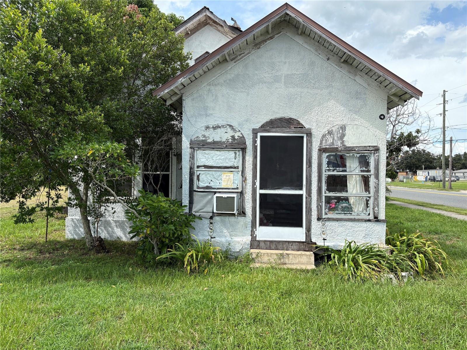 THE VALUE IS IN THE LAND! Bring your highest and best! This corner lot sits on a high traffic road with great visibility. A great location for commercial development or a new residential build (rentals perhaps?) ! Lot next door is also for sale. Structure is unsafe, enter at your own risk. Buyer/Buyer representative should verify all information re zoning, densities, building restrictions, utilities, etc.