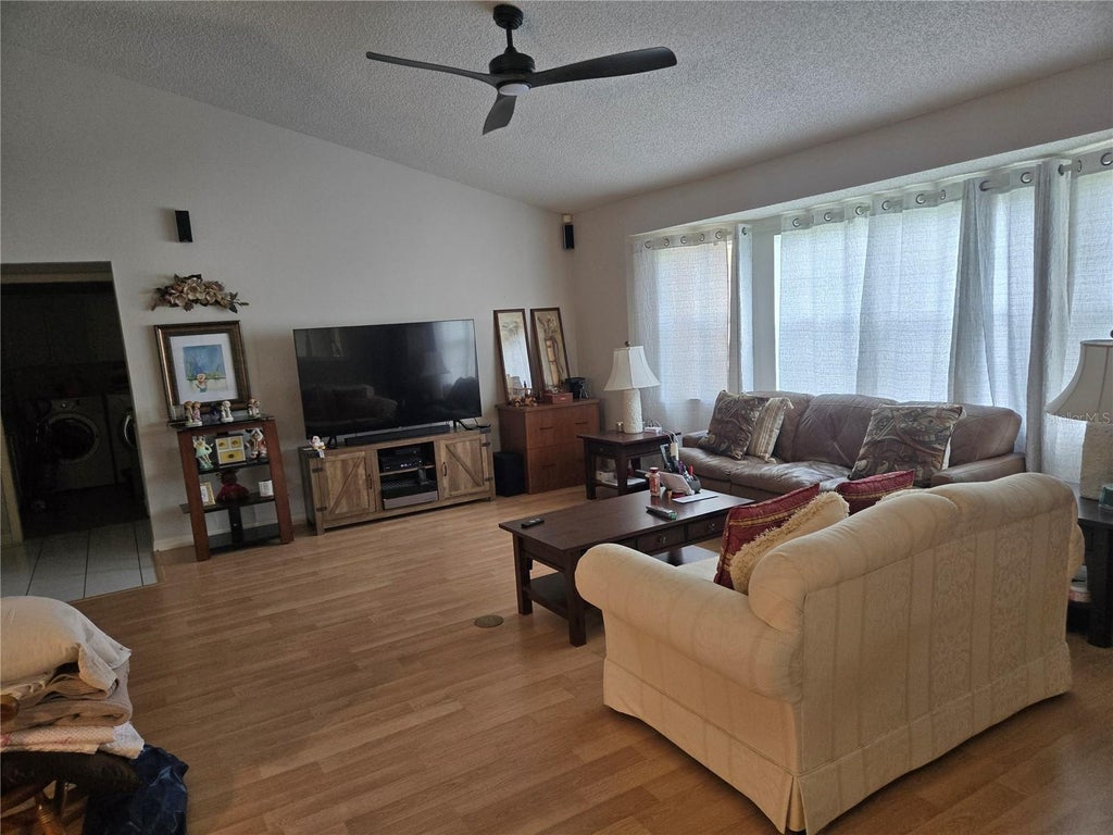 Photo of 5506 Prince Charles Lane, Leesburg, FL 34748 (MLS # O6416308)