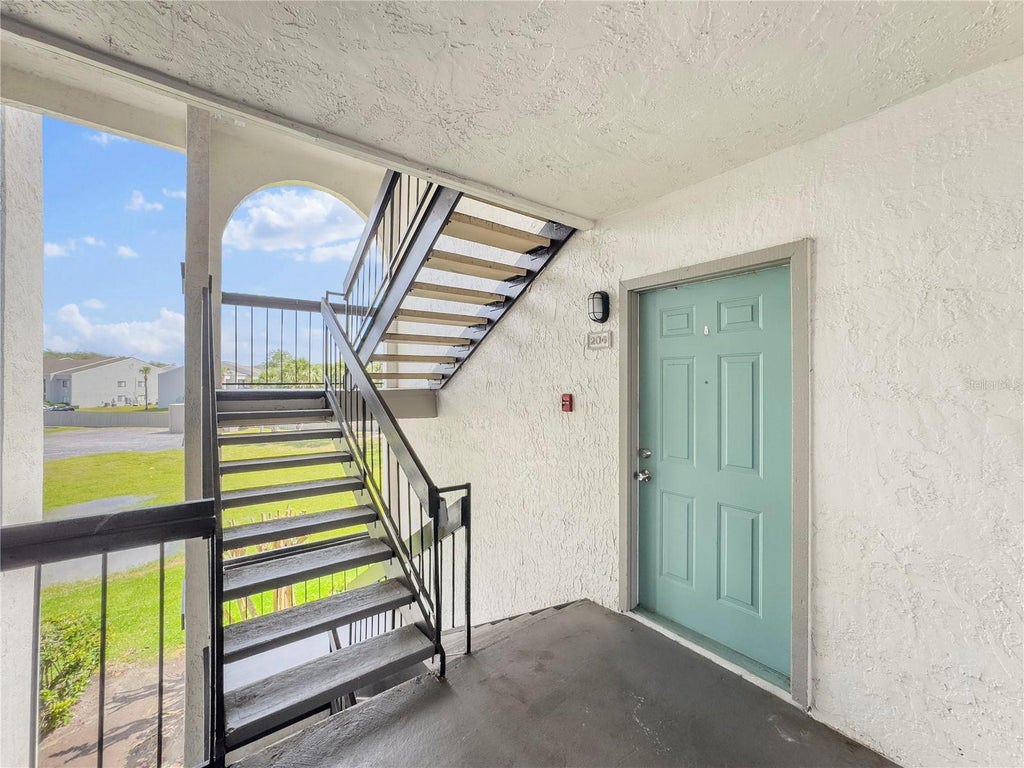 Photo of 2130 Cascades Boulevard #204, Kissimmee, FL 34741 (MLS # O6440174)
