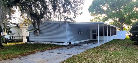 Photo of 1150 Country Club Lane, Lakeland, FL 33801 (MLS # S5145810)