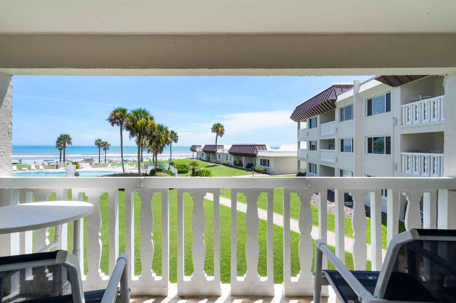 Chateau by the Sea's Unit 20C offers a perfect beach escape for families or friends. This spacious 2-bedroom, 2-bathroom condo features a private balcony with stunning ocean views. Dive into the on-site pool for refreshment, or the beach beckons steps away. Prepare meals in the fully-equipped kitchen, and unwind with complimentary Wi-Fi and cable TV after a day of exploring. Unit 20C's ideal location near shops, restaurants, and activities puts you in the center of New Smyrna Beach's charm.