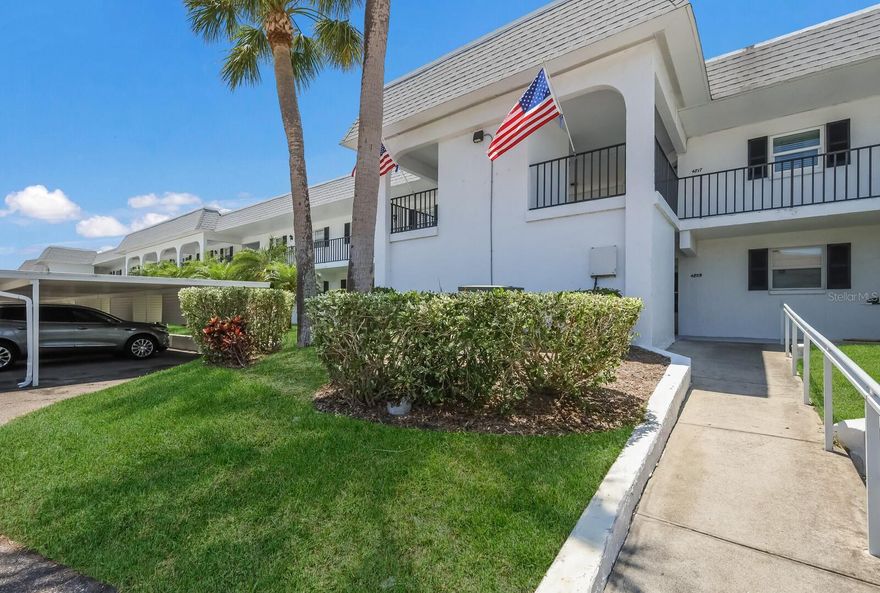 One or more photo(s) has been virtually staged. Welcome home, and bring your boat, as docks are available for a low fee of 25.00 with no fixed bridges to the Gulf! This spacious, two bedroom two bath, light & bright ground-floor end unit has been tastefully updated throughout. Some of the recent upgrades include: a new air conditioning unit in 2020, and in 2021 new receptacles / switches, remodeled bathrooms, carpeting in the bedrooms, window coverings, raised ceiling in the kitchen with recessed lighting, top of the line Samsung appliances, Maytag washer & dryer, hot water heater, and a garbage disposal. Enjoy your morning coffee or watch the birds at sunset in the enclosed lanai overlooking the pond and bay while avoiding the heat as the sliding glass doors have been recently tinted. This lovely residence is just a few short steps to everything the community has to offer including the pool, clubhouse, tennis and pickleball! The convenient covered carport parking and personal storage is located directly outside of your front door. Mount Vernon is a 55+ amenity rich, vibrant and very active waterfront community. There are many routine socials and fun / interactive activities and is maintenance free, offering a wonderful lifestyle at great value. The clubhouse has been newly remodeled with a new roof, banquet room, billiards, ping-pong, library & game room. Outdoors you will find the heated pool, a lakeside veranda, boat docks, tennis & pickleball courts, shuffleboard courts, spa, sauna, workshop & woodshop, chip & putting green, walking paths, butterfly garden, bayfront park, kayak launch & storage, bayside pavilion, lakeside gazebo, bird sanctuary, many ponds and spacious grounds of nearly 90 acres of wonderful Florida wildlife. Minutes by car, boat & bike to Bradenton's / Anna Maria's stunning white sandy beaches, a freshly caught dinner, live music with unique dining, shops, and top-notch medical facilities. (Dues include: water, sewer, trash, recycle, landscape maintenance, pest control inside/outside, cable 200 channels with HD box, internet at speed of 100 with router, exterior maintenance repairs & replacement including, roof, fascia, soffit) Some photos have been virtually staged.