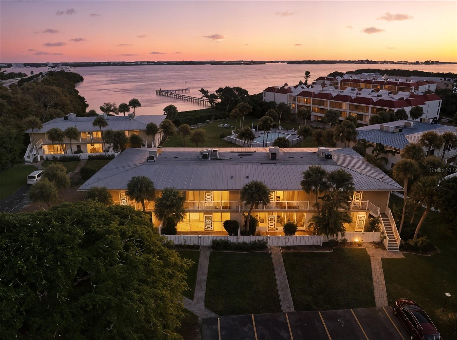 RENOVATED AND TURNKEY.  Prepare to be enthralled by the mesmerizing beauty of the sparkling waters of Anna Maria Sound, teaming with playful dolphins, graceful manatees, and the colorful spectacle of Florida's native birds. Witness spectacular sunrises as you wake up to the beautiful rays filling your space every morning. Then there is the magnificent moon while casting its illuminating reflection upon Anna Maria Sound, all from this incredible place. This building sits on one of the highest points on the island and did not flood during previous storms. This makes it an Excellent investment.  Sit on the Lanai and watch the yachts as they await the Manatee Bridge to lift so they can go under. This beautifully remodeled condo on the water is one of the few dog friendly communities. If all this wasn't enough the space you walk into is being sold Turnkey and looks as if a professional designer made all the decisions down to the smallest things.  Now its all your ready to go just pack a suitcase and no need to do anything.  Are you a bird watcher? If so you will love the birds you view all day as they fly close to you coming to and fro from nearby Robinson Preserve. One of the nicest things about this place is you don't get stuck during season in all the traffic on the island and its easy to get off to the main land without the long wait that the owners on the north end or south end have. Community has a kayak launch and pickleball as well as tennis and a large heated pool with views of the water. Community HOA fees are much lower than most due to the lack of damage as compared to other places on the island.