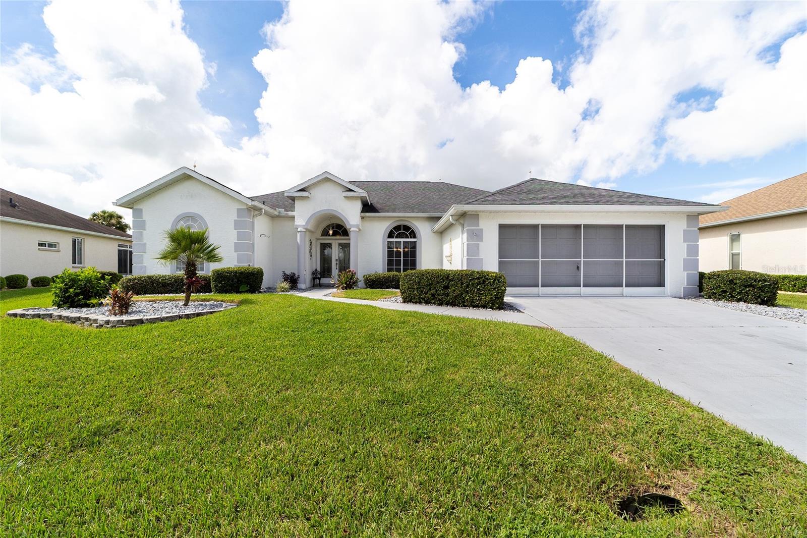 GOLF COURSE POOL HOME IN OCALA PALMS! PRICED UNDER MARKET VALUE and built to last with block and stucco construction, this 3 bedroom, 2 bath pool home offers lush golf course views and an easy lifestyle. The split floor plan features a spacious family room overlooking the sparkling heated saltwater pool and fairways beyond. The primary suite includes a bonus room—ideal for an office, hobby space, or private retreat. Mature landscaping frames the screened pool area, creating a relaxing backdrop for everyday living or entertaining. Practical updates include a NEW ROOF (2017) and NEW AC (2021) for added peace of mind. Conveniently located, Ocala Palms sits across from a shopping plaza with Publix, Walgreens, banking, Starbucks, restaurants, new hotel, free-standing ER, storage facilities, Gold’s Gym and so much more! With I-75 just half a mile away and the World Equestrian Center only 5 minutes down the road, you’ll have quick access to everything you need.