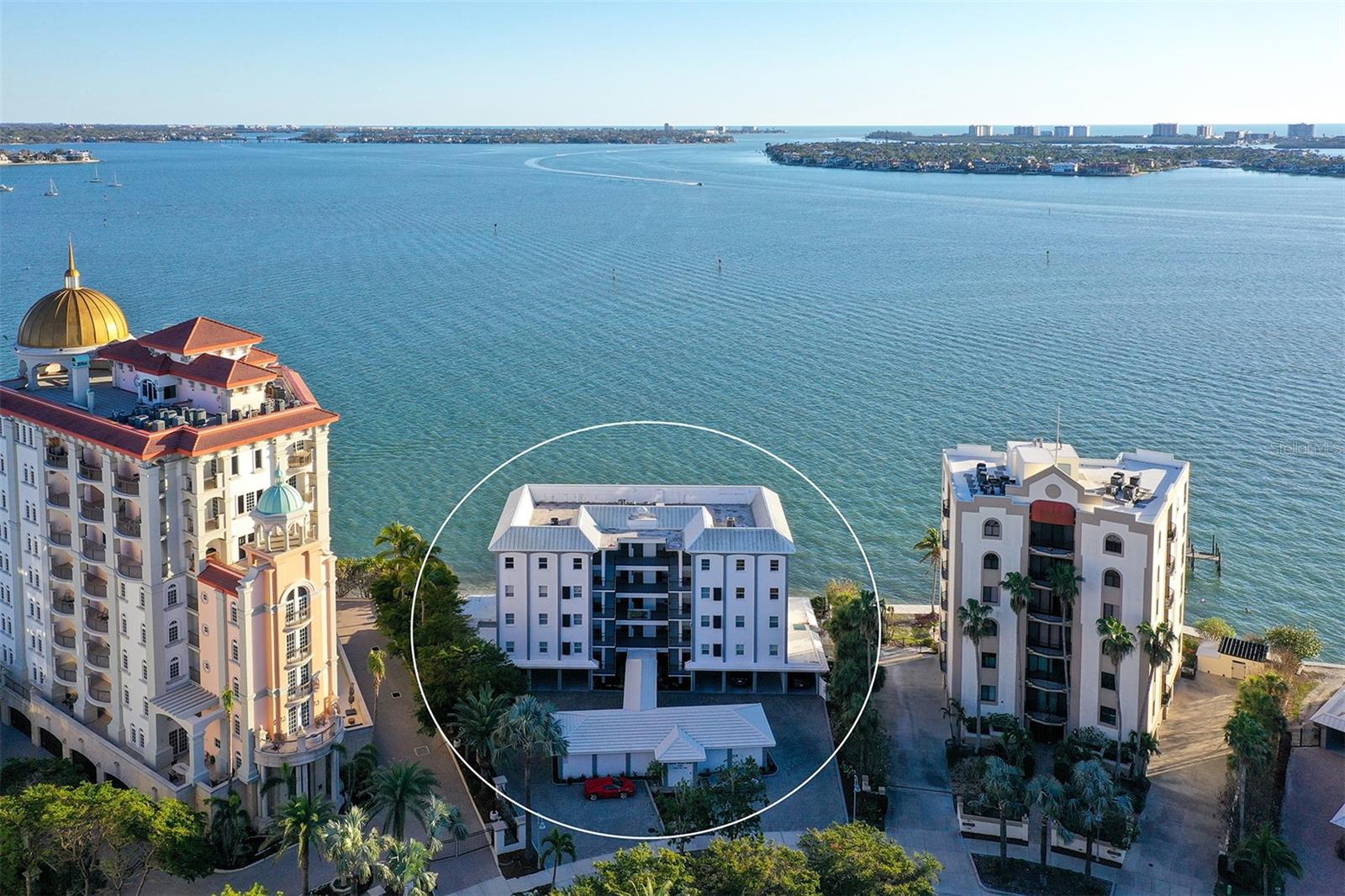 One of the most unique waterfront penthouses on Golden Gate Point in downtown Sarasota, this fully renovated condo was combined from two units and designed with an open floor plan to maximize the best views in the community. At the tip of Golden Gate Point, you will enjoy 180-degree panoramic views from the city to the marina, to the Ringling Bridge with sunrises, sunsets, marine life and boating activity. With nearly 3,000 square feet and 75 linear feet of living space, there is plenty of room for relaxing or entertaining while enjoying the amazing views of the bay from the floor-to-ceiling windows. With three bedrooms and three-and-a-half baths, this is the condominium for families or for hosting guests. The main bedroom suite features waterfront views and includes a large closet with built-ins and an upgraded bath with dual vanities, soaking tub and shower. The gourmet kitchen features an expansive granite island with Bosch appliances and looks out toward the dining area with windows providing endless water views. A split floor plan, the other side of the condominium features an en-suite bedroom, second guest bedroom, full bath, half bath, laundry and utility room. The spacious front porch is a great place to enjoy the outside with convenient access to the elevator. Two parking spaces with a storage closet come with this condominium and are conveniently under the building. The location doesn't get much better than this, just a few minutes to Marina Jacks and downtown Sarasota and less than 10 minutes to St. Armands Circle and Lido Beach. Don't miss this opportunity to own a one-of-a-kind modern renovated condominium with some of the best views on Golden Gate Point.