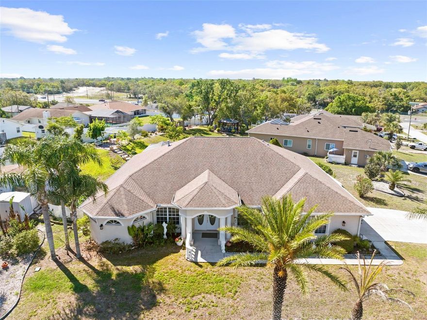 WELCOME TO 134 GALENA AVENUE – A PRIVATE, UPGRADED POOL ESTATE IN THE HEART OF SPRING HILL! Step into this beautifully maintained 3-BEDROOM, 2-BATH home offering 2,165 square feet of living space on an expansive .45-ACRE LOT. Custom built in 2005 and lovingly cared for by its original owners, this home is truly PACKED WITH UPGRADES, thoughtful features, and incredible INDOOR-OUTDOOR LIVING. Inside, you’ll find a bright OPEN-CONCEPT layout with VAULTED CEILINGS and a desirable SPLIT FLOOR PLAN. The spacious living room is the heart of the home, complete with a cozy GAS FIREPLACE, built-in seating area, and large sliders that open to the pool, creating seamless indoor-outdoor flow. A versatile FLEX SPACE off the main living area offers the perfect setup for a home office or additional lounge.
The home features two dining areas, including a large FORMAL DINING ROOM and a casual dining nook off the kitchen with sliders overlooking the pool. The kitchen is open to the living room and equipped with STAINLESS STEEL APPLIANCES, a pantry closet, plenty of cabinet space, and a new garbage disposal, making it both functional and inviting for entertaining. The primary suite is generously sized and designed as a true retreat, featuring sliders to the pool area, DOUBLE WALK-IN CLOSETS, and a spacious en-suite bathroom with dual sinks, a JETTED TUB, and a walk-through shower with dual shower heads. The guest bedrooms are also large, offering AMPLE CLOSET SPACE, and the guest bathroom includes direct access to the pool area for added convenience. Step outside to your own private oasis. The HUGE screened-in pool area with pavers features a SALTWATER POOL, a large covered space with fans, and a fully equipped OUTDOOR KITCHEN complete with a pizza oven, gas stove, and grill, perfect for entertaining year-round. The backyard is a dream for anyone who loves space and functionality. It truly feels like you’ve stepped into your own private park. You’ll find TWO SHEDS WITH ELECTRIC AND WATER, a FENCED GARDEN, and mature landscaping including AVOCADO, MANGO, and FIG TREES, along with grapevines growing over a charming gazebo. There is also space for RV OR BOAT PARKING tucked behind the sheds. This home is loaded with valuable upgrades, including a GENERATOR, HOME SECURITY SYSTEM, 2019 A/C, a 120-GALLON UNDERGROUND PROPANE TANK (servicing the fireplace and outdoor kitchen), and a NEWER DRAIN FIELD sized for a 4-bedroom home. The garage offers extensive built-in storage, attic storage space, and even a FINISHED ATTIC area above the pool patio for additional storage. The property also features underground drainage systems connected to the downspouts for added efficiency. Conveniently located with easy access to the Suncoast Parkway and Tampa International Airport, this home offers both privacy and accessibility for commuting, travel, and everyday convenience. With its rare combination of space, upgrades, privacy, and resort-style outdoor living, 134 Galena Avenue is truly one-of-a-kind. Homes like this don’t come around often. Schedule your private showing today and experience it for yourself!