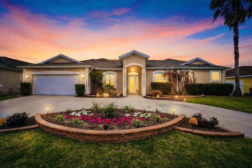 One or more photo(s) has been virtually staged. Two primary suites. Designer updates. Prime location!

This stunning home in the Villages of Parkwood offers 4 bedrooms, 3 bathrooms, and 2,611 square feet of BEAUTIFULLY REFRESHED living space with a layout that truly stands out. From the moment you arrive, the CIRCULAR DRIVEWAY and attractive curb appeal create a memorable first impression. Inside, you’ll find FRESH NEUTRAL INTERIOR PAINT, BRAND-NEW LUXURY VINYL PLANK FLOORING throughout, MODERN LIGHT FIXTURES, UPDATED HARDWARE, PLANTATION SHUTTERS, and a brand-new stove, all coming together to create a home that feels stylish, polished, and MOVE-IN READY.

One of the most exciting features is the TWO TRUE PRIMARY SUITES—a rare and highly desirable setup that offers exceptional flexibility for MULTI-GENERATIONAL LIVING, extended guests, or private work-from-home space. There is also an additional flex room that can easily function as a 4th bedroom, home office, or den, giving you even more options to fit your lifestyle.

The spacious kitchen is designed for both everyday living and entertaining, featuring GRANITE COUNTEROPS, an island, recessed lighting, and an easy flow into the family room and eat-in nook. Thoughtful details like CUSTOM TRAY CEILINGS in the dining room and primary suite add architectural interest, while the SHOW-STOPPING floor-to-ceiling stone FIREPLACE with a sleek linear insert brings warmth, texture, and upscale designer appeal to the main living space.

The primary bedroom offers an en-suite bathroom that is a retreat of its own, complete with DUAL VANITIES, a spa-like ROMAN SHOWER with RAIN SHOWER HEADS, a GARDEN BATHTUB, and private toilet/water closet. 

Step outside to enjoy the FULLY-FENCED BACKYARD, perfect for pets, play, and gatherings, along with a lanai with JACUZZI HOOKUP ready for your dream outdoor oasis.

And the location? It’s hard to beat. Ideally situated just five minutes from The Villages Charter Schools and moments from The Villages and Southern Trace shopping district, you’ll have shopping, dining, grocery stores, and everyday conveniences right at your fingertips.

This home offers the RARE COMBINATION of space, flexibility, standout style, and location that buyers are searching for. A MUST-SEE. Call today for your private showing!