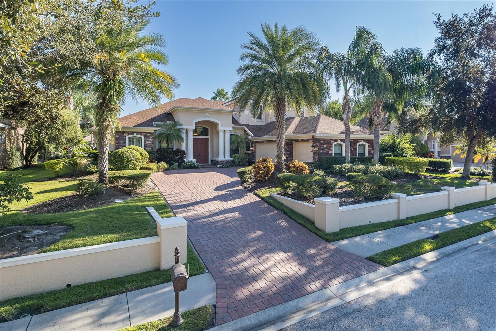 Luxury Living in Prestigious CHAMPIONS CLUB – Custom Pool Home on Private Cul-de-Sac! Welcome to the epitome of luxury living in this immaculate home boasting 4,000 square feet. Nestled on a 1/3 acre lot on serene cul-de-sac within a sought-after golf course-resort styled community, this custom-built estate offers elegance, comfort, and privacy—perfectly designed for both everyday living and entertaining. Featuring 5 spacious bedrooms, 5 full bathrooms, a dedicated office, and a versatile bonus room, this home offers room for everyone and everything. Step inside to discover soaring ceilings, upgraded hurricane-impact windows, newer laminate flooring & custom tile floors flow throughout the main living areas. The open-concept floor plan seamlessly connects the living, dining, and gourmet kitchen—complete with custom cabinetry, custom hood, stainless steel appliances, induction cook-top, large walk-in pantry with wood shelving, high-end finishes, and ample counter space. Enjoy the convenience of a first-floor primary suite featuring a spa-inspired en suite and 2 oversized walk-in closets. A second first-floor suite, also with its own en suite bath and dual closets, provides ideal accommodations for guests or multi-generational living. Step outside to your private backyard oasis—a sparkling pool with no rear neighbors offering ultimate peace and seclusion. The extra-large side-load garage adds both curb appeal and functionality. This 2015 custom built home has many recent updates: NEW water softener (2023), NEW water heater (2023), Newer Intelliflo variable speed & flow pool pump (2022), Pentair clean & clear poor filter system (2025), NEW 5 Ton HVAC downstairs (2024), NEW 1.5 Ton HVAC upstairs (2025), Upgraded Hurricane IMPACT WINDOWS throughout entire home (except mitered window in breakfast area (no shutters needed for storms - only the 1 window), Upgraded sliding glass doors & so much more! Champions Club is a private gated community featuring a private clubhouse, Resort-style pool & spa, Fitness Center, Tennis, Pickle ball, Basketball & many planned activities for all ages throughout the year. Zoned for A+ rated schools, Trinity Elementary, Seven Springs Middle & J.W. Mitchell High. Conveniently located close to many shops, restaurants, medical facilities, SunCoast Pkwy & short drive to many local beaches, Tampa International Airport & St. Pete/Clearwater Airport! One of Tampa Bay's Premier Communities with so much to offer its residents! Amazing Champions Club Value under 1 Million!!