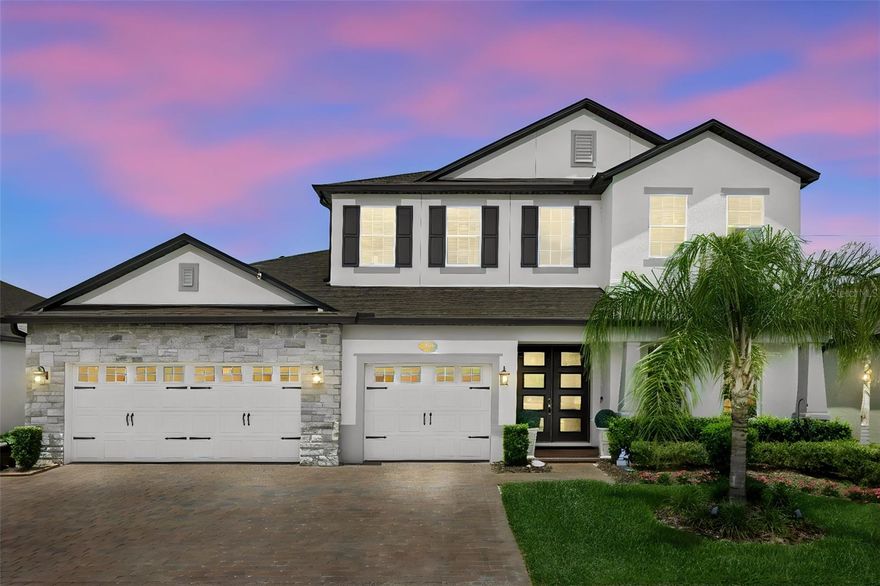 Ohhhh My Goodness! Where do I start? If you are looking for a home that presents like a builder's model, inside a secured gated neighborhood {Red Ember North}, you have found it! Please allow me to walk you through this masterpiece. This home was custom built in 2022 by the current owners. The builder is M/I Homes and the model is The Tradewinds, and all of the upgrades were included. This home offers 4 full bedrooms, media room and office. The expansive en-suite primary bedroom and bathroom on the 1st level includes his and hers closets! There is a quiet office in the front of the home, and the remaining 3 large bedrooms are upstairs along with a decked-out media room including slated wall panels along with a walk-in temperature-controlled storage room. This home truly checks all of the boxes. There are 3 full bathrooms along with one half bath and a large laundry room with a full-sized stackable washer/dryer combo. The open concept kitchen leads into the family room featuring a stacked stone accent wall and built-in fireplace, and the dining room with a stunning coffered ceiling. Through the sliders your eyes are drawn to the sparkling solar-heated pool with 2 beautiful fire bowls on either side for ambiance, and a large screened enclosed patio area, perfect for those long summer days and warm summer nights. Rounding out the perfection is the oversized 3-car garage with attic storage. Oviedo is known for its A-rated schools, parks, shopping and restaurants and this neighborhood is also located just a hop-skip-and a jump from University of Central Florida (go Knights!) Schedule your showing of this showstopper and start living the carefree lifestyle this home offers to you and your family!
